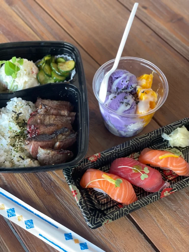 Japanese bento box with sushi and dessert