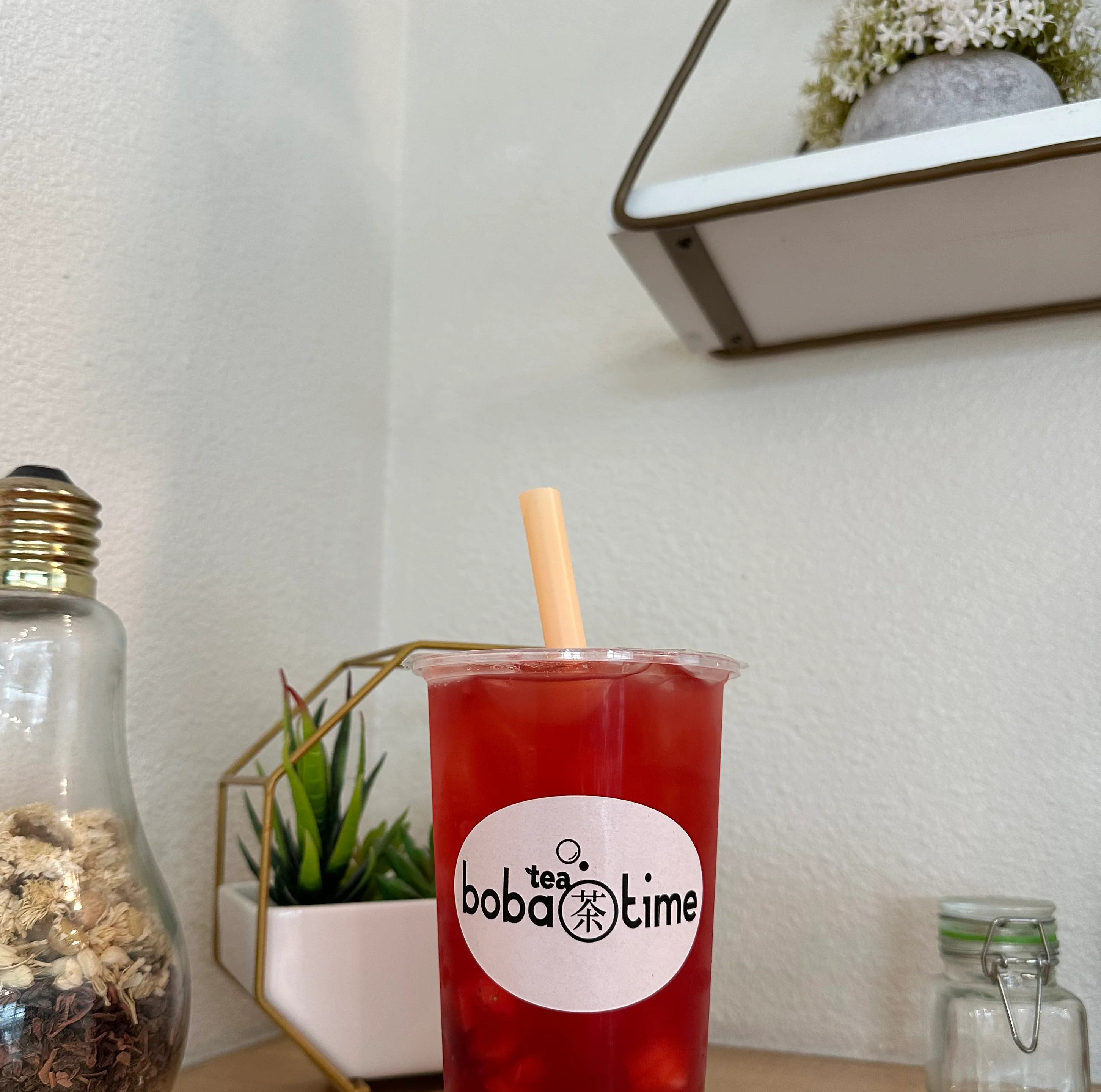 Refreshing fruit tea with boba pearls in a clear cup