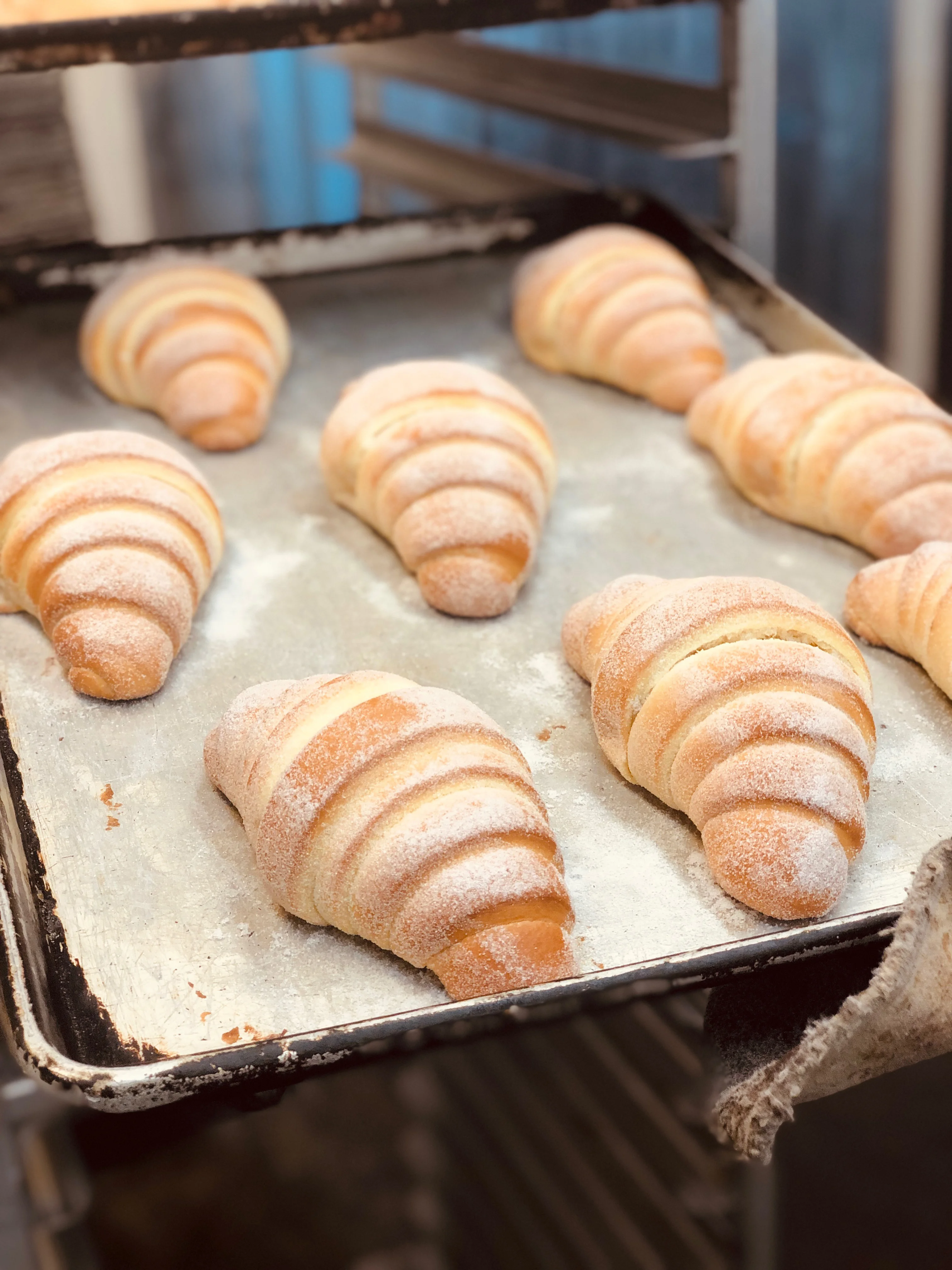 Freshly baked croissants dusted with sugar
