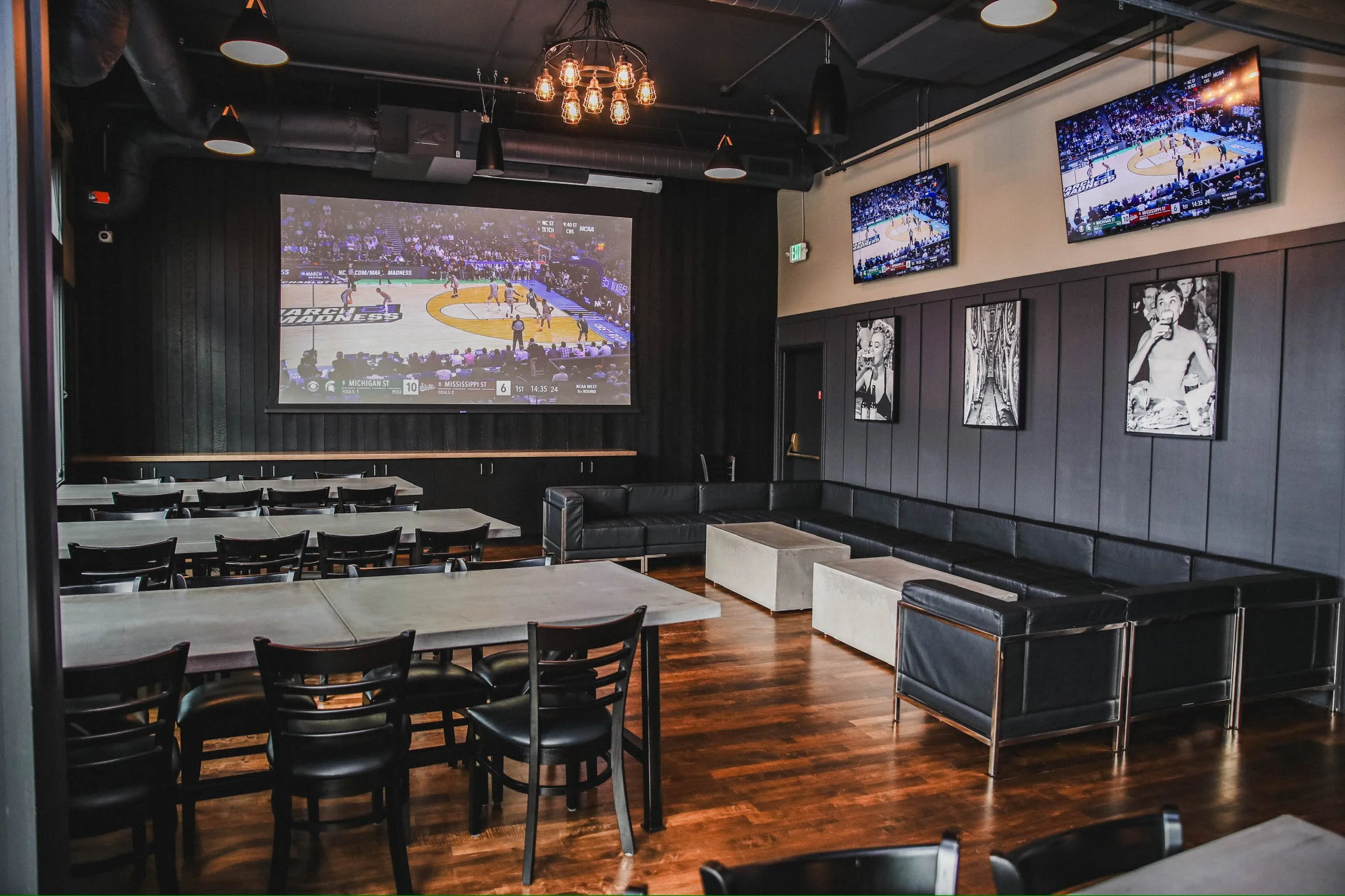 Modern sports bar interior with large screens