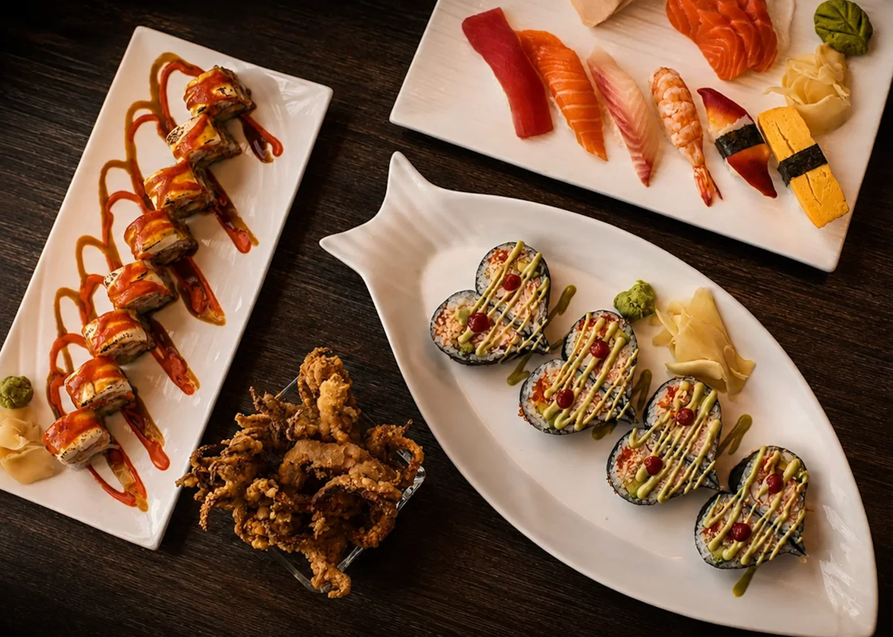 Japanese sushi platter with assorted rolls and sashimi