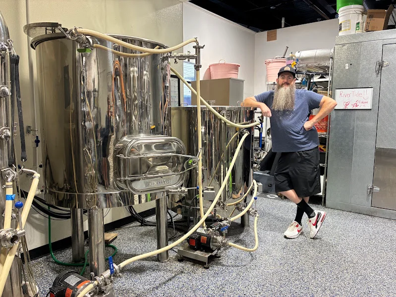 Brewery equipment with stainless steel tanks and hoses