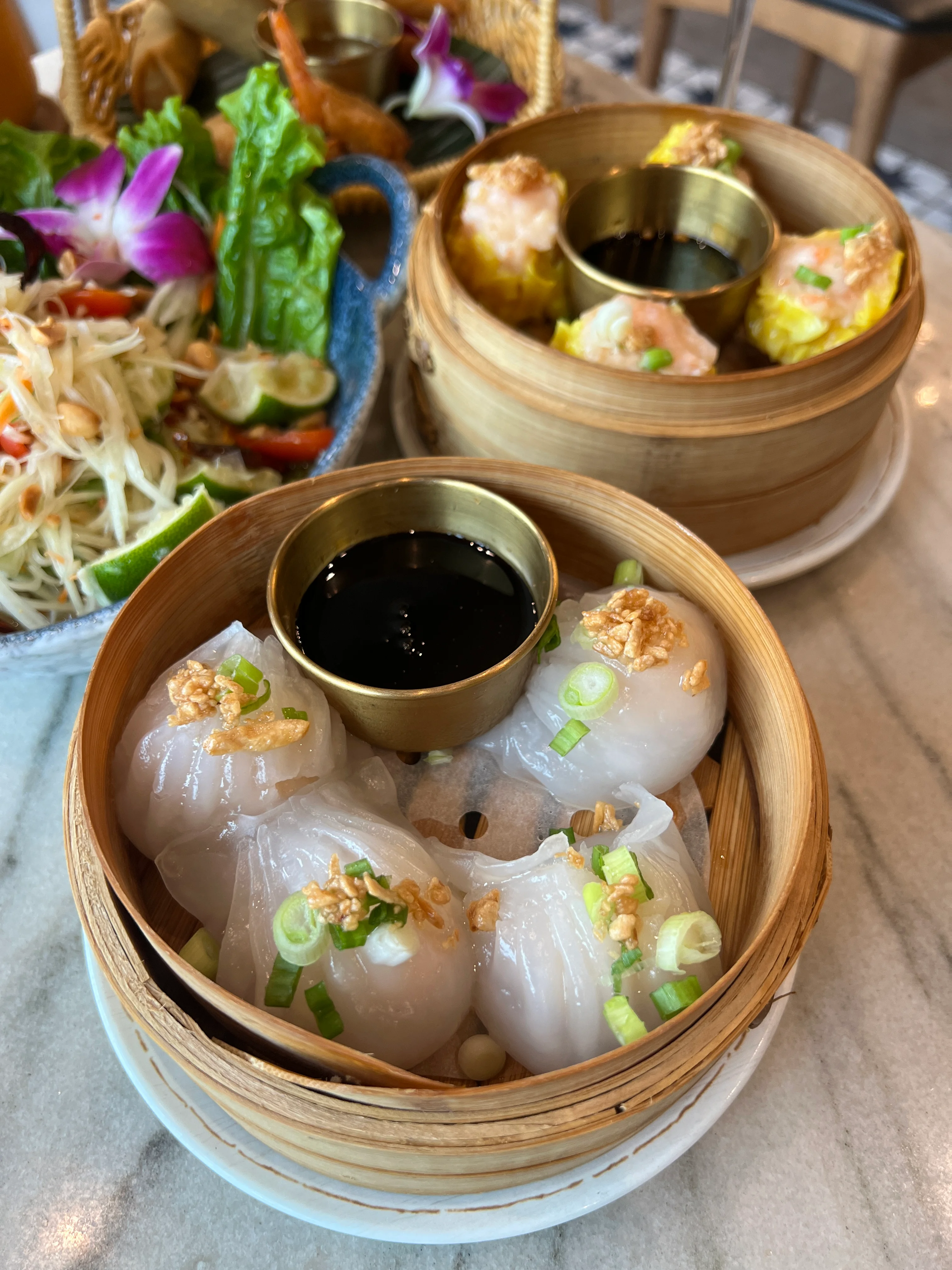 Dim sum platter featuring har gow and siu mai
