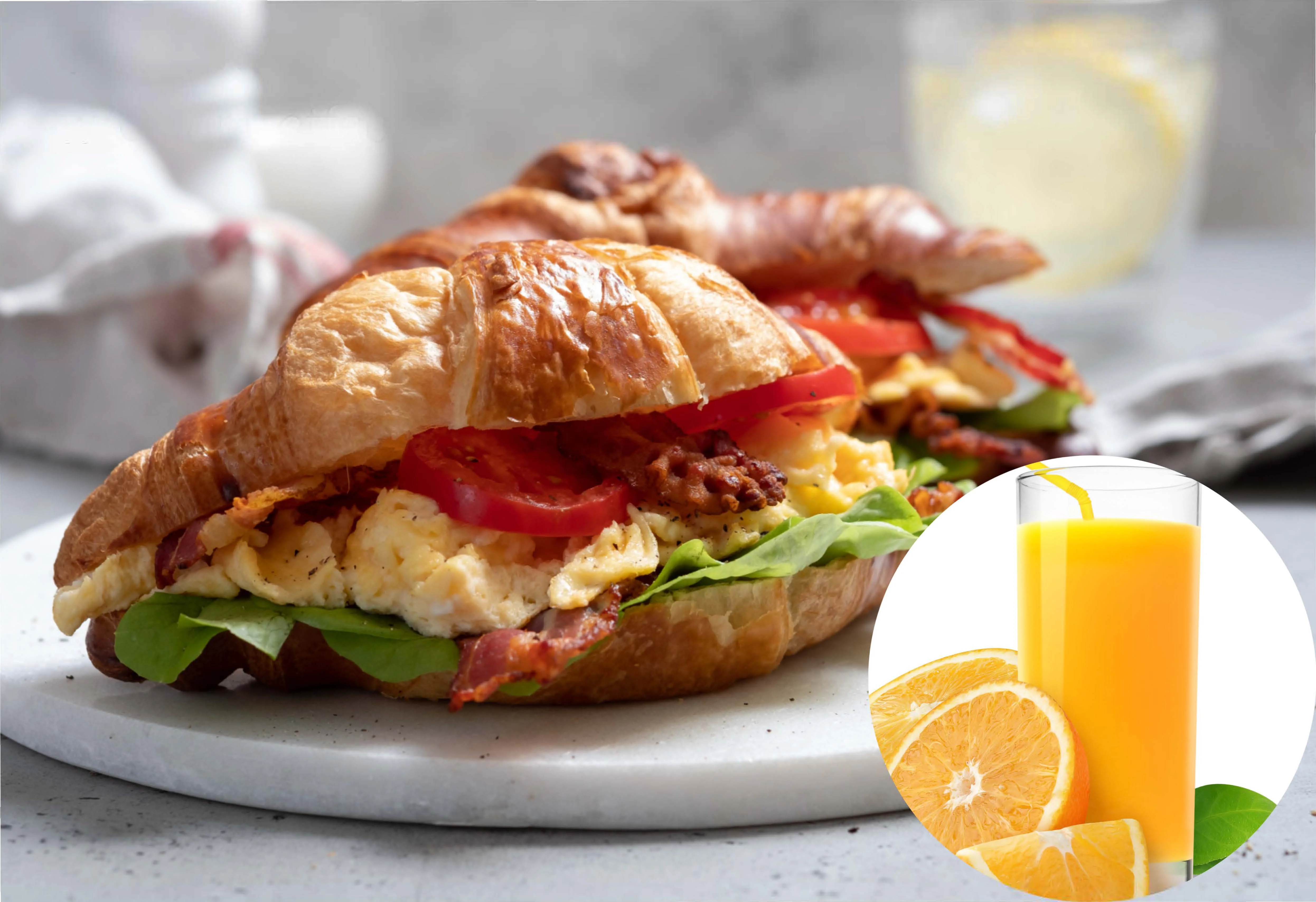 Croissant sandwich with eggs and bacon