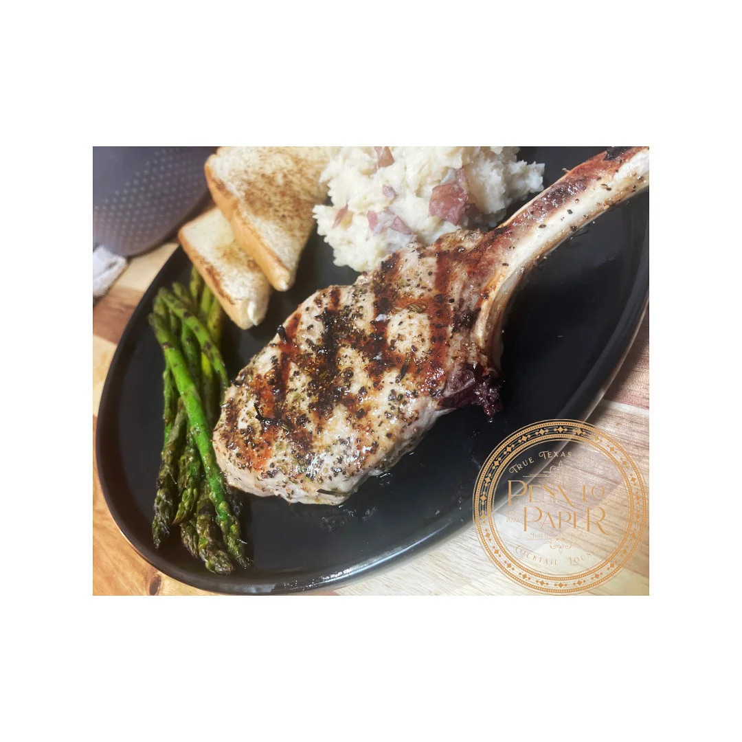 Grilled pork chop with sides of asparagus and mashed potatoes