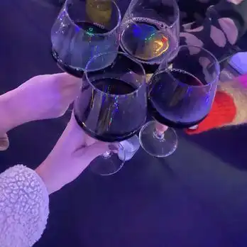 Four wineglasses saying cheers in an outdoor igloo at King Jugg Brewing Company