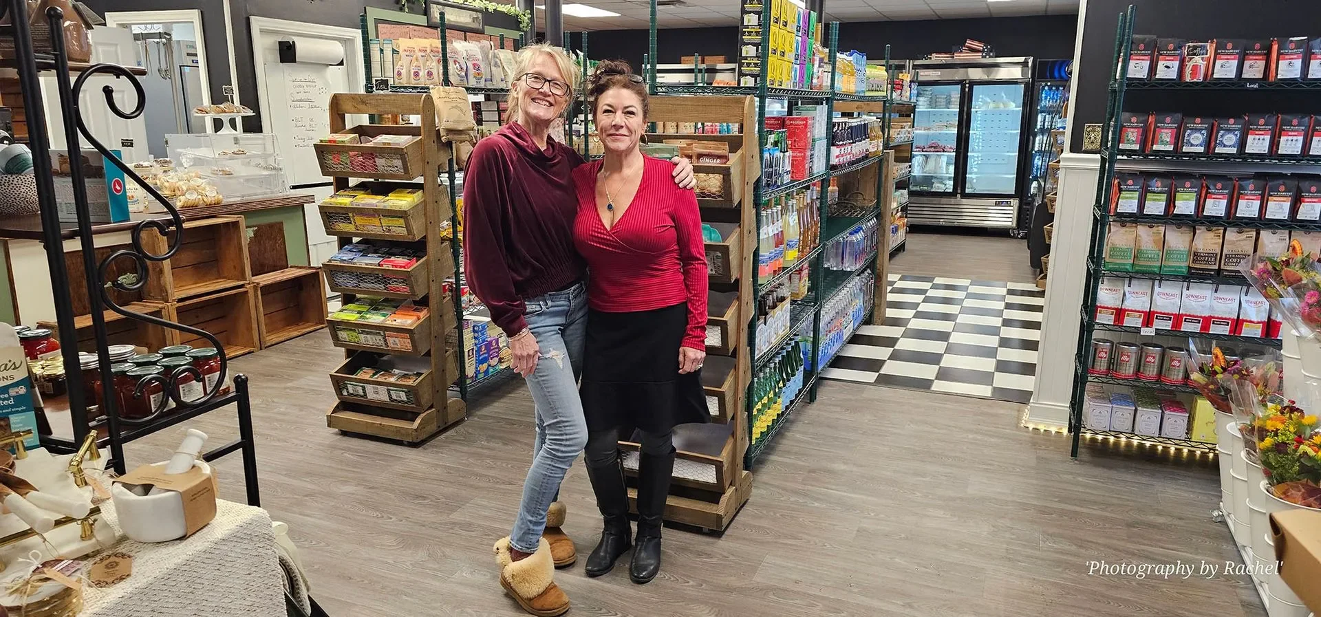 Charming store interior with shelves of goods and two smiling women