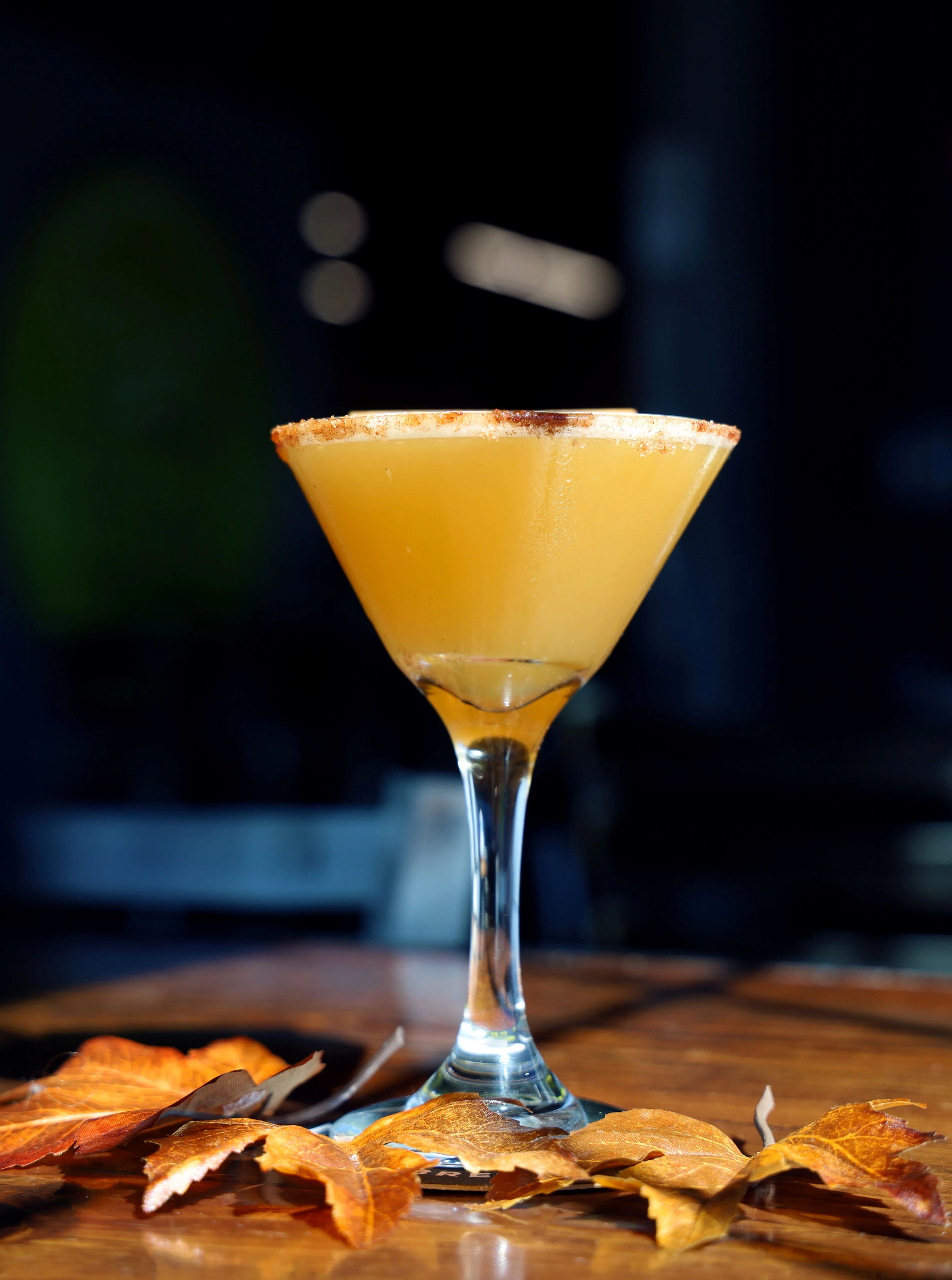 Refreshing pink cocktail with lemon garnish