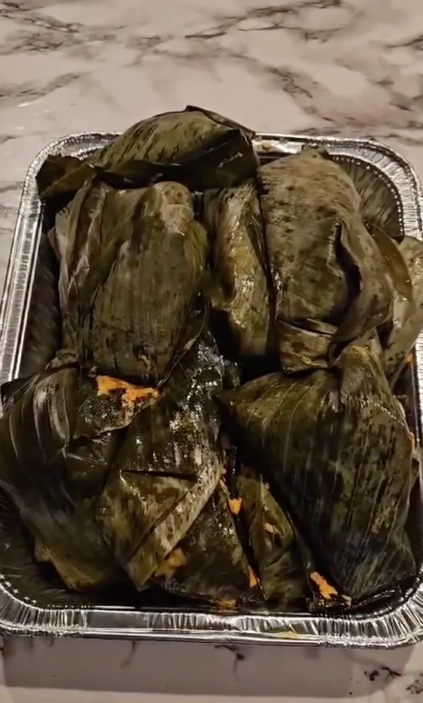 Traditional Mexican tamales wrapped in banana leaves