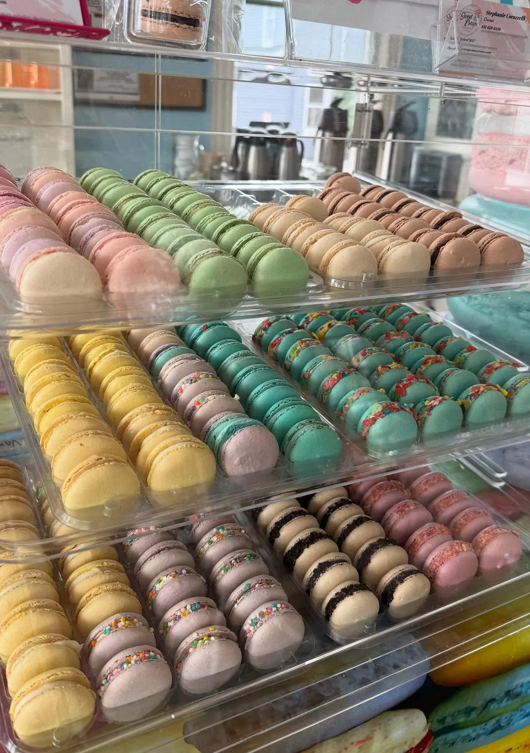 Colorful display of French macarons in various flavors