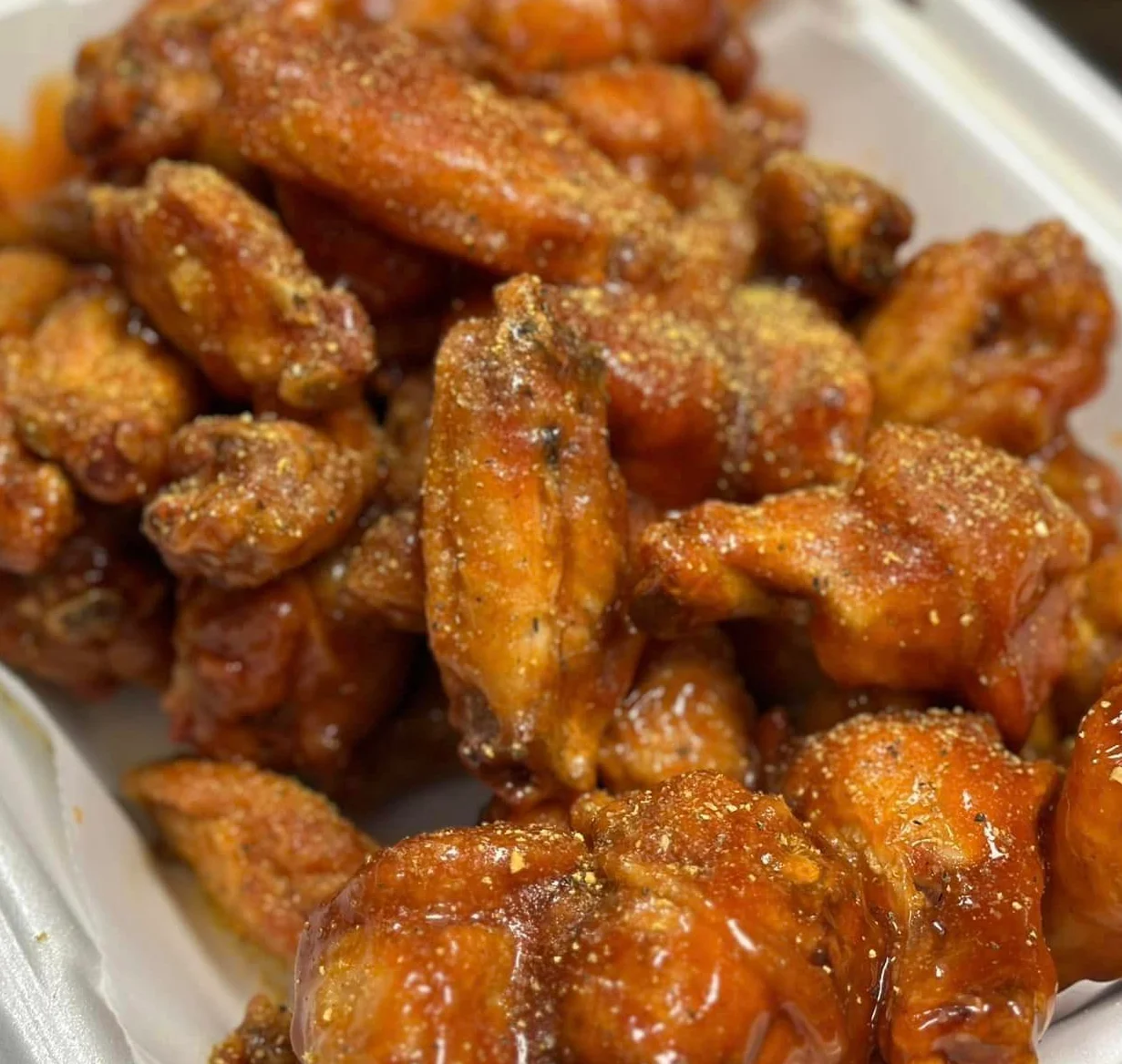 Crispy buffalo chicken wings with a spicy glaze