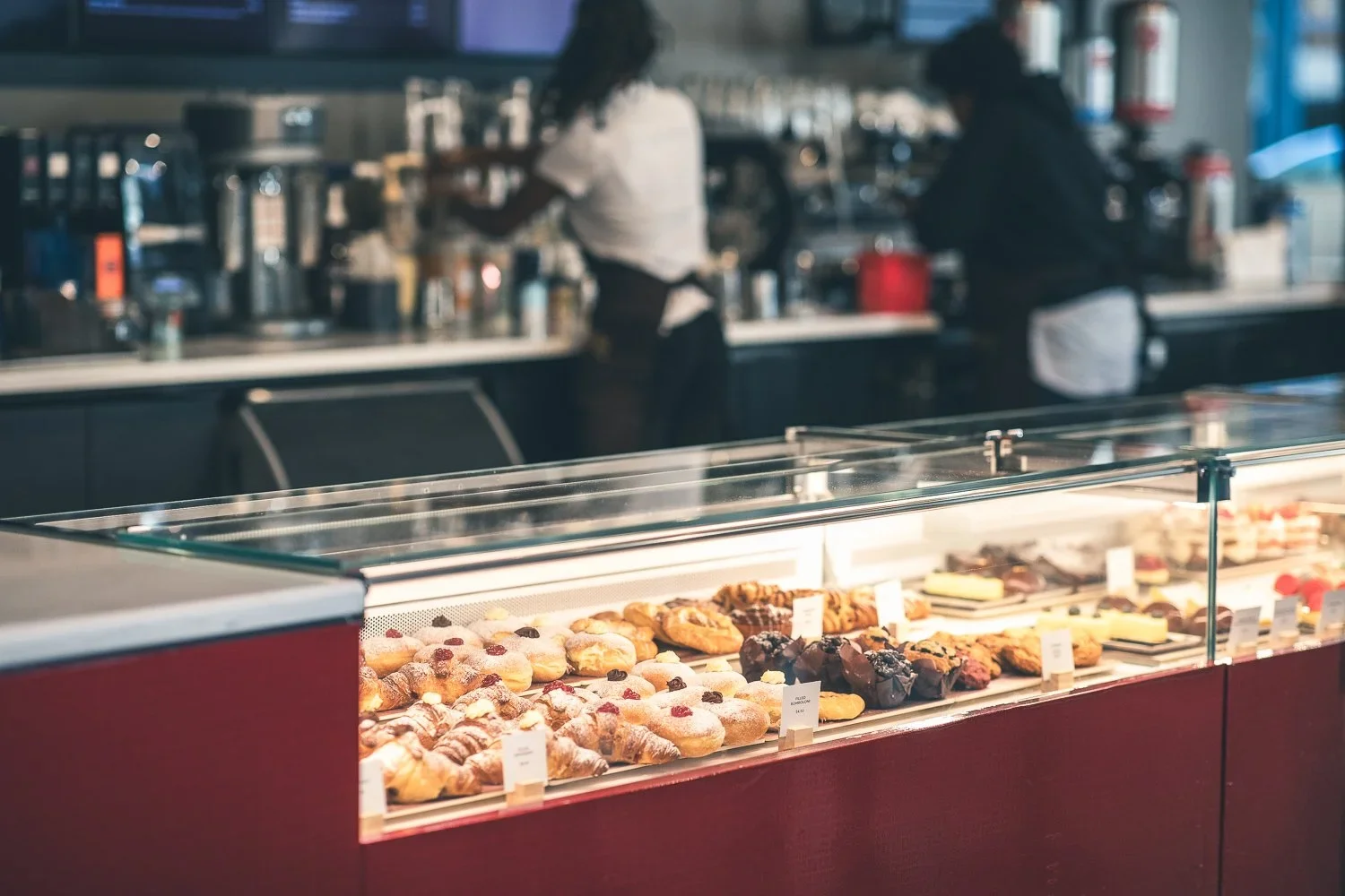 Display of assorted pastries in a modern café