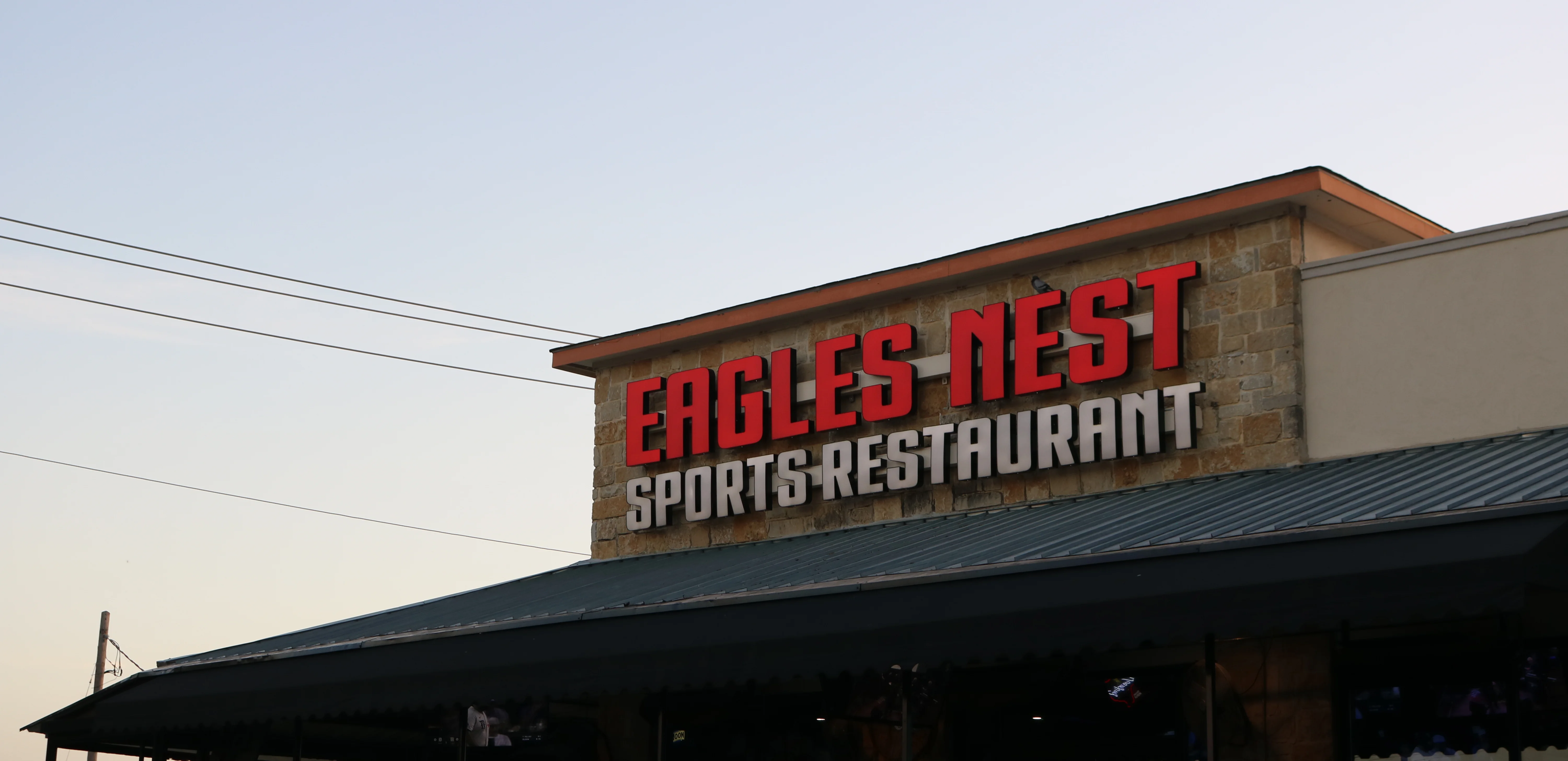 Eagles Nest Sports Restaurant exterior at sunset