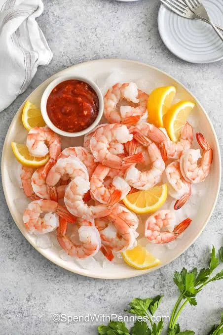Chilled shrimp cocktail with lemon and cocktail sauce