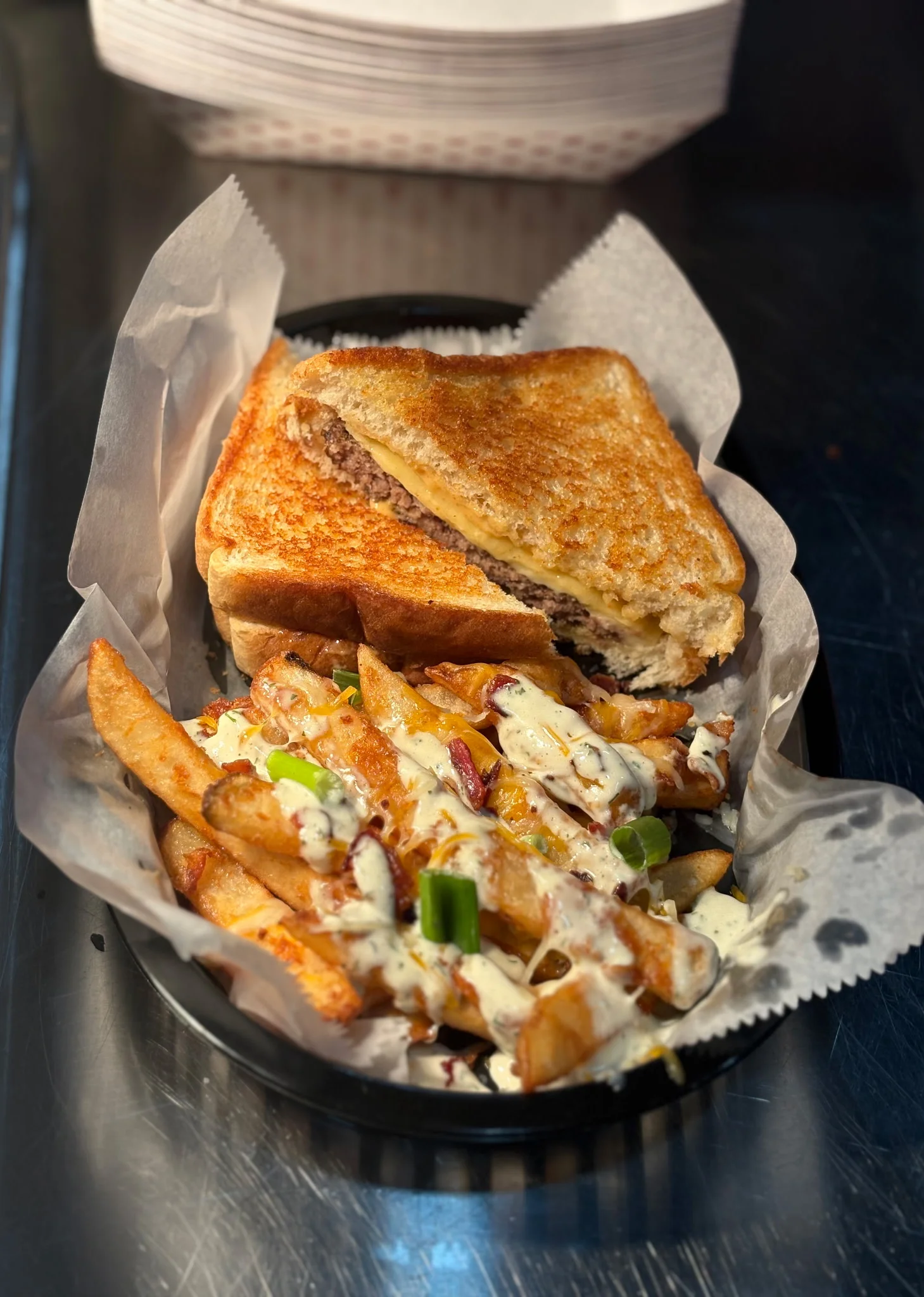 Grilled cheese sandwich with loaded fries