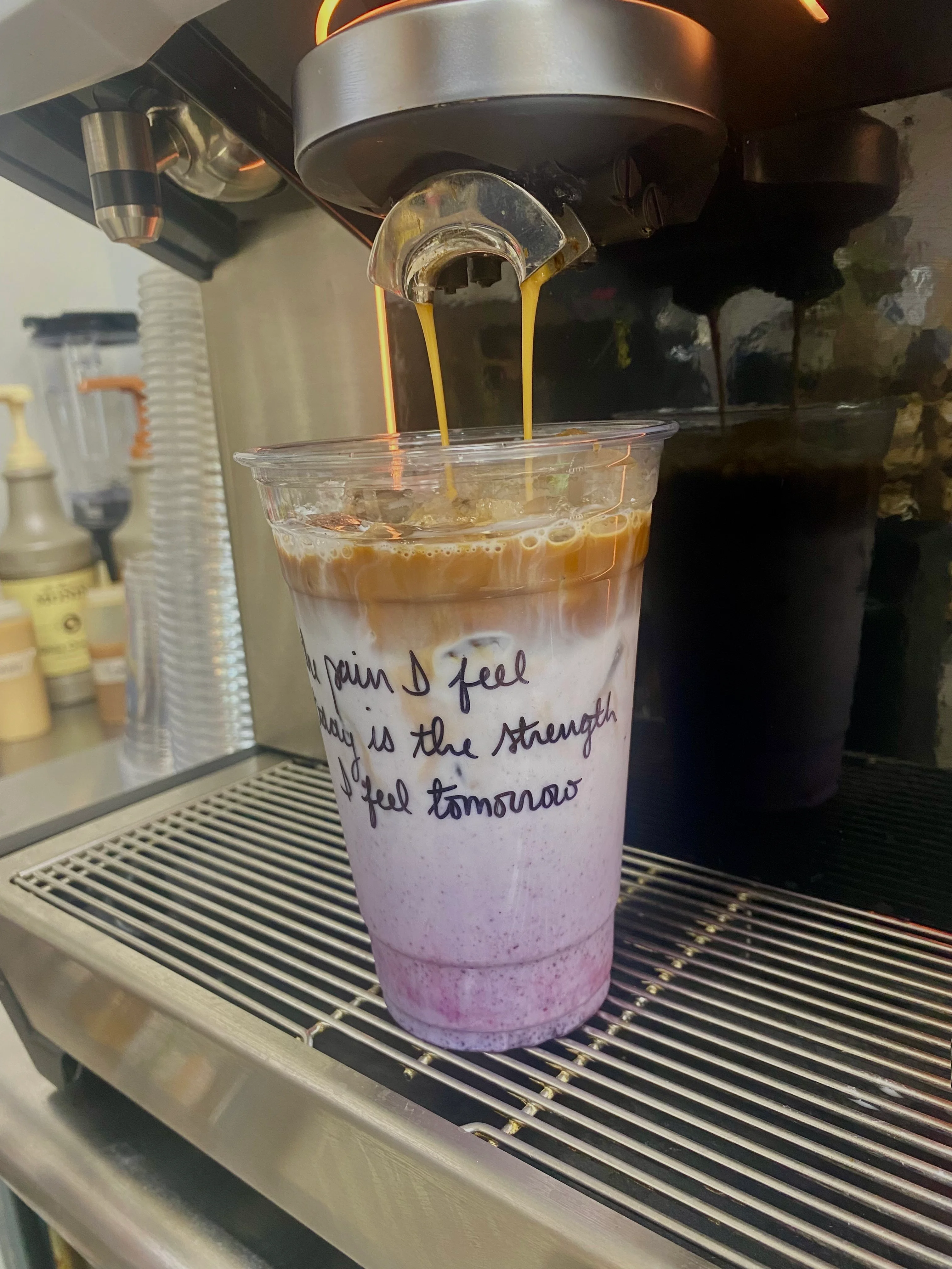 Iced coffee drink with layered milk and espresso
