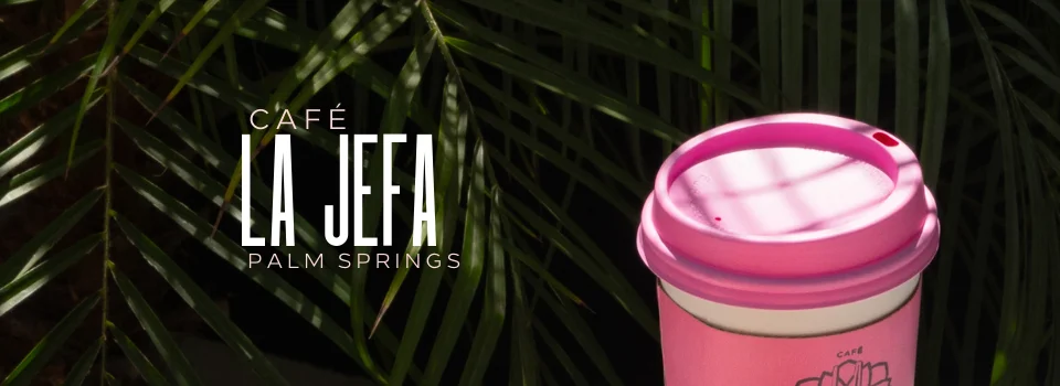 Café La Jefa coffee cup in Palm Springs with tropical backdrop