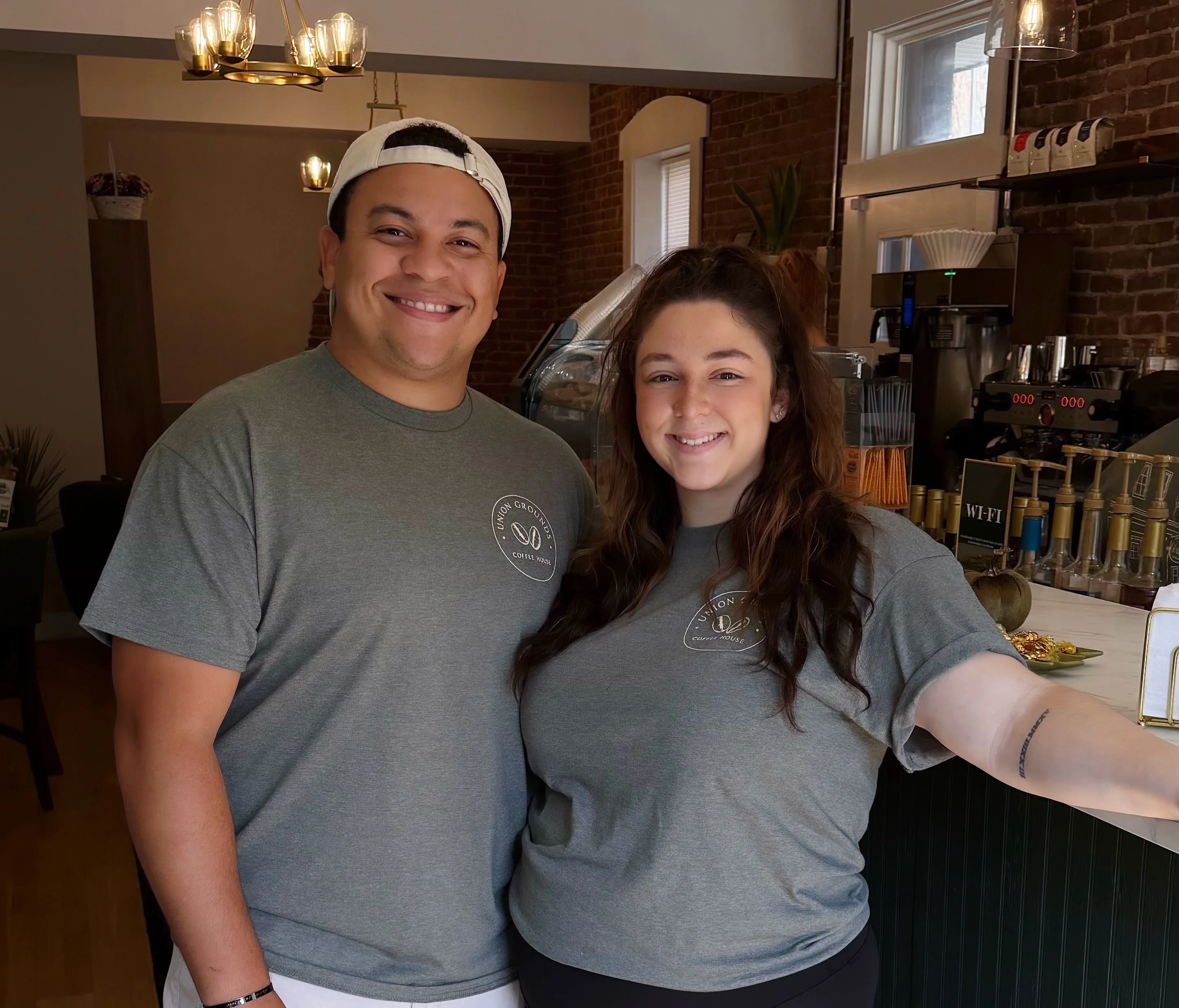 Friendly staff at a cozy café with a welcoming atmosphere