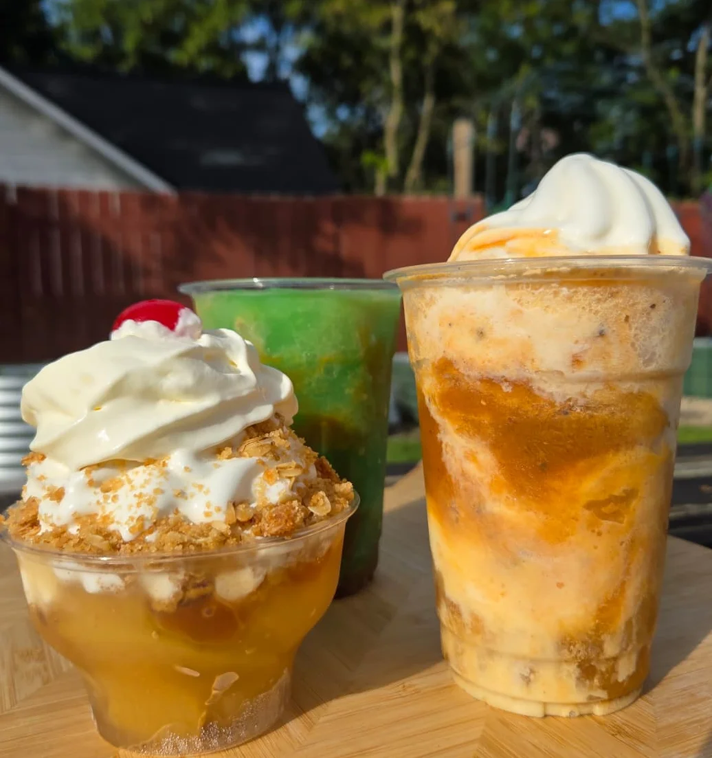 Colorful shaved ice desserts with whipped cream and tropical shaved ice drinks