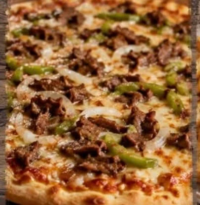 Philly cheesesteak pizza with melted cheese and toppings