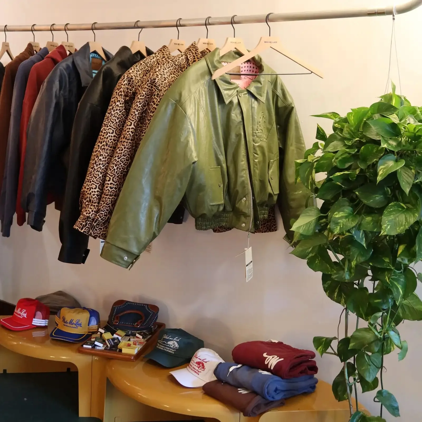 Stylish vintage jackets and caps displayed in a trendy boutique