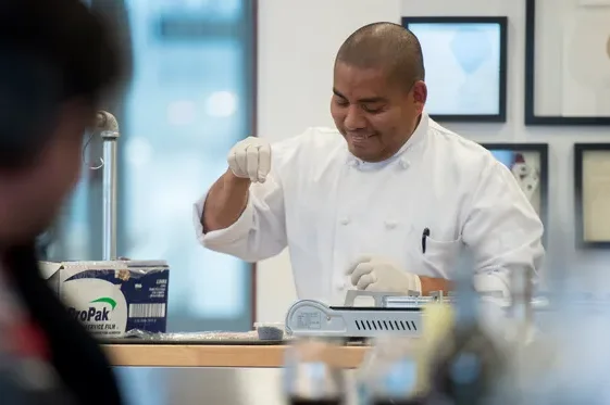 Chef preparing a dish in a modern restaurant kitchen