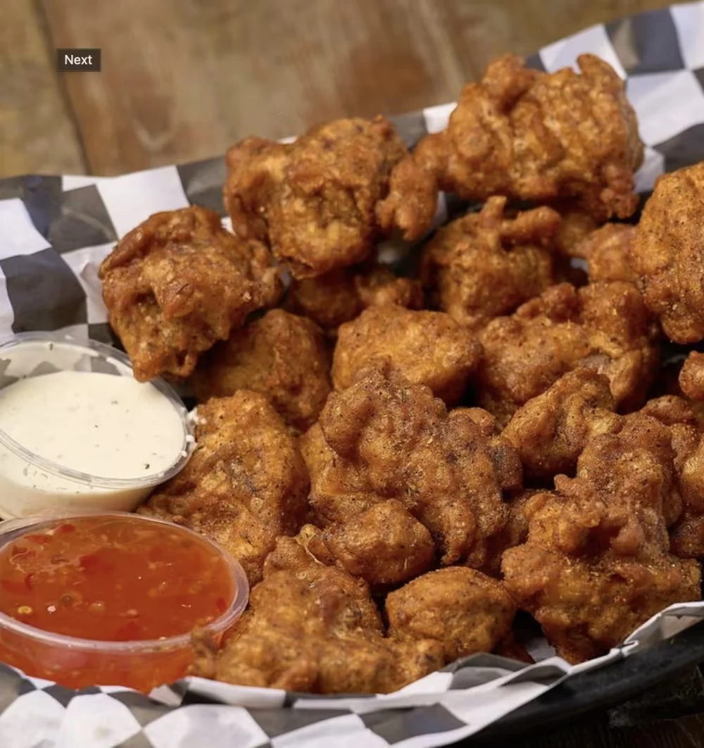 Crispy Southern hush puppies served with dipping sauces