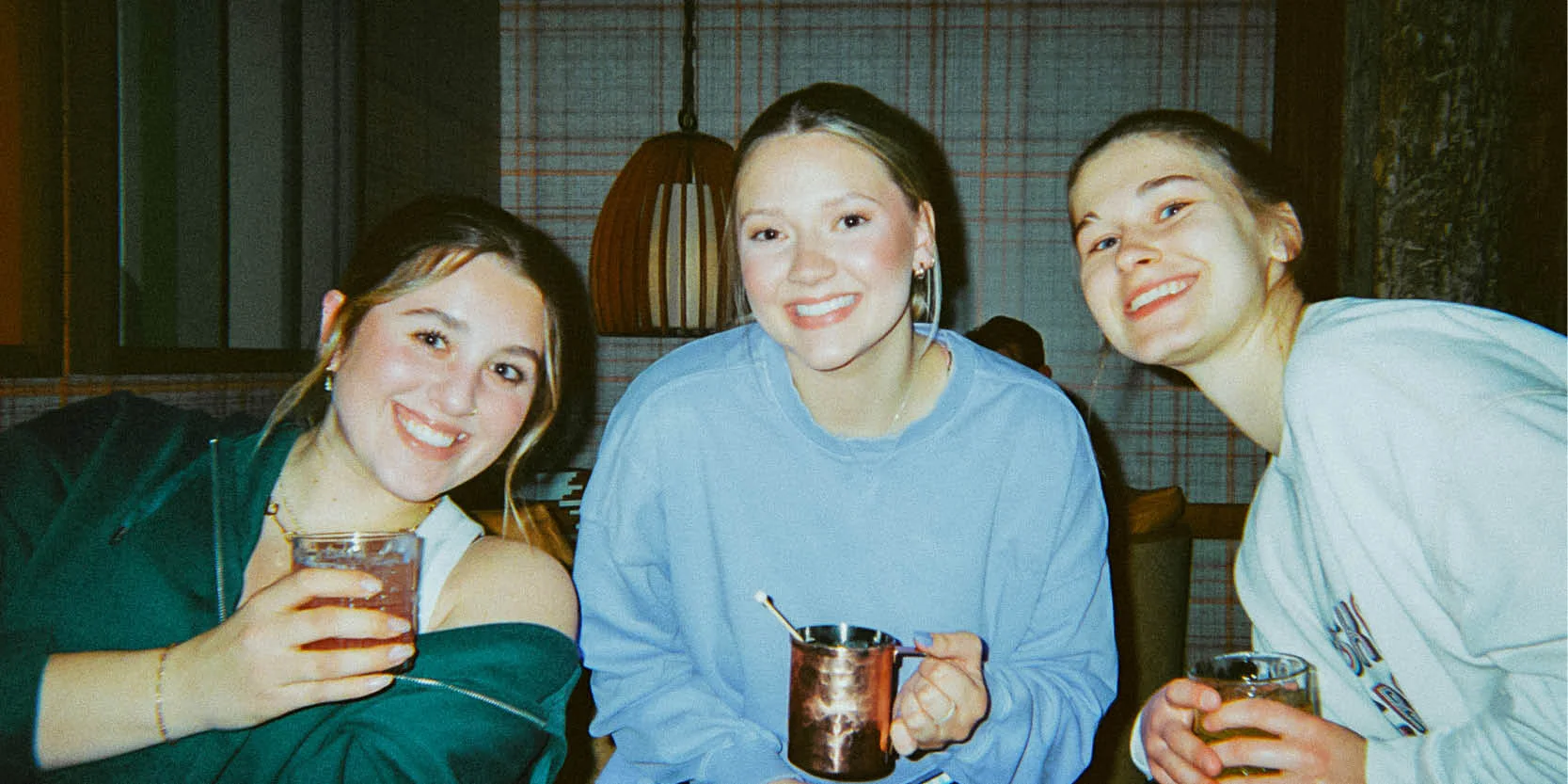 Three friends enjoying drinks 