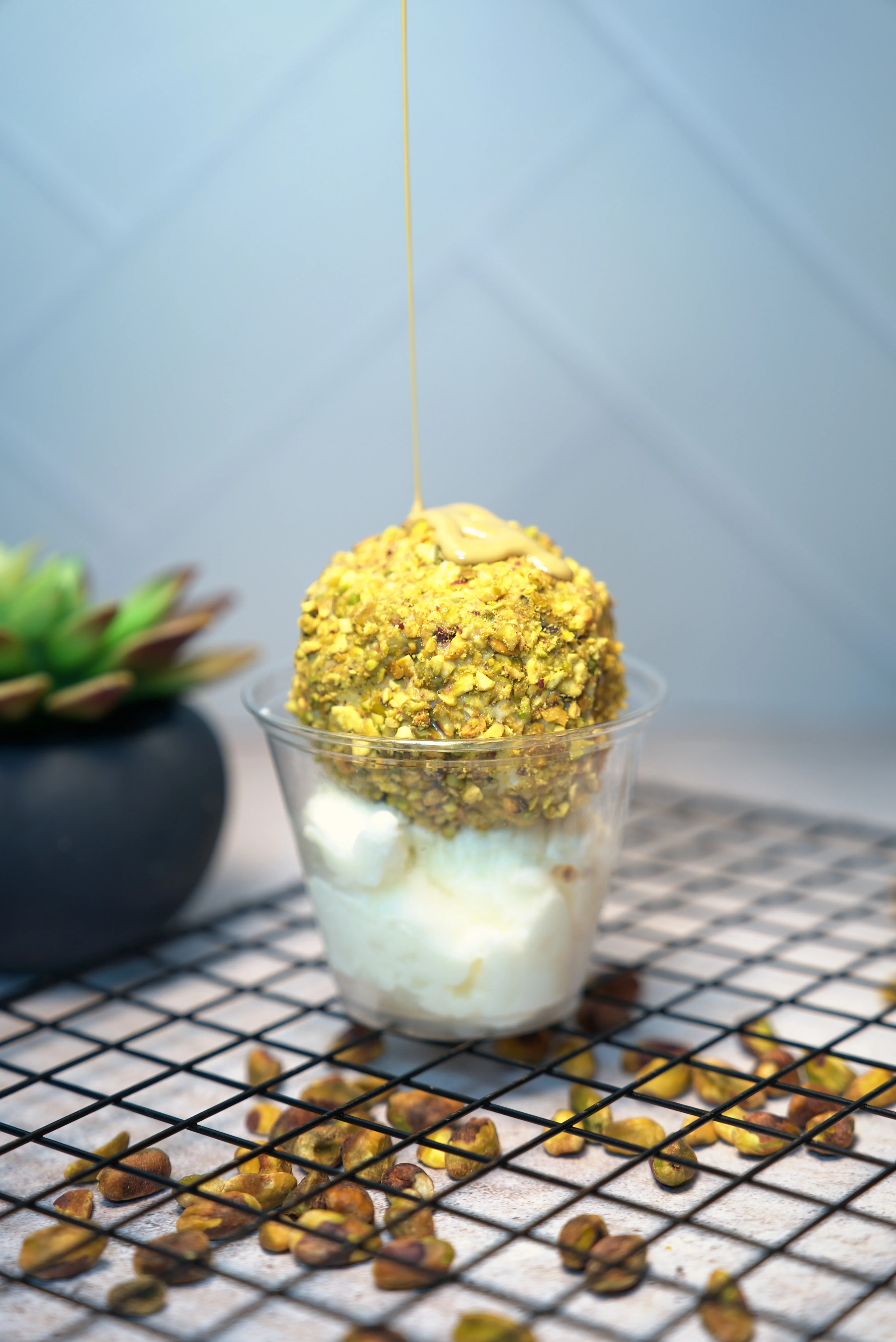 Close-up of golden savory food with sauce in a glass dish