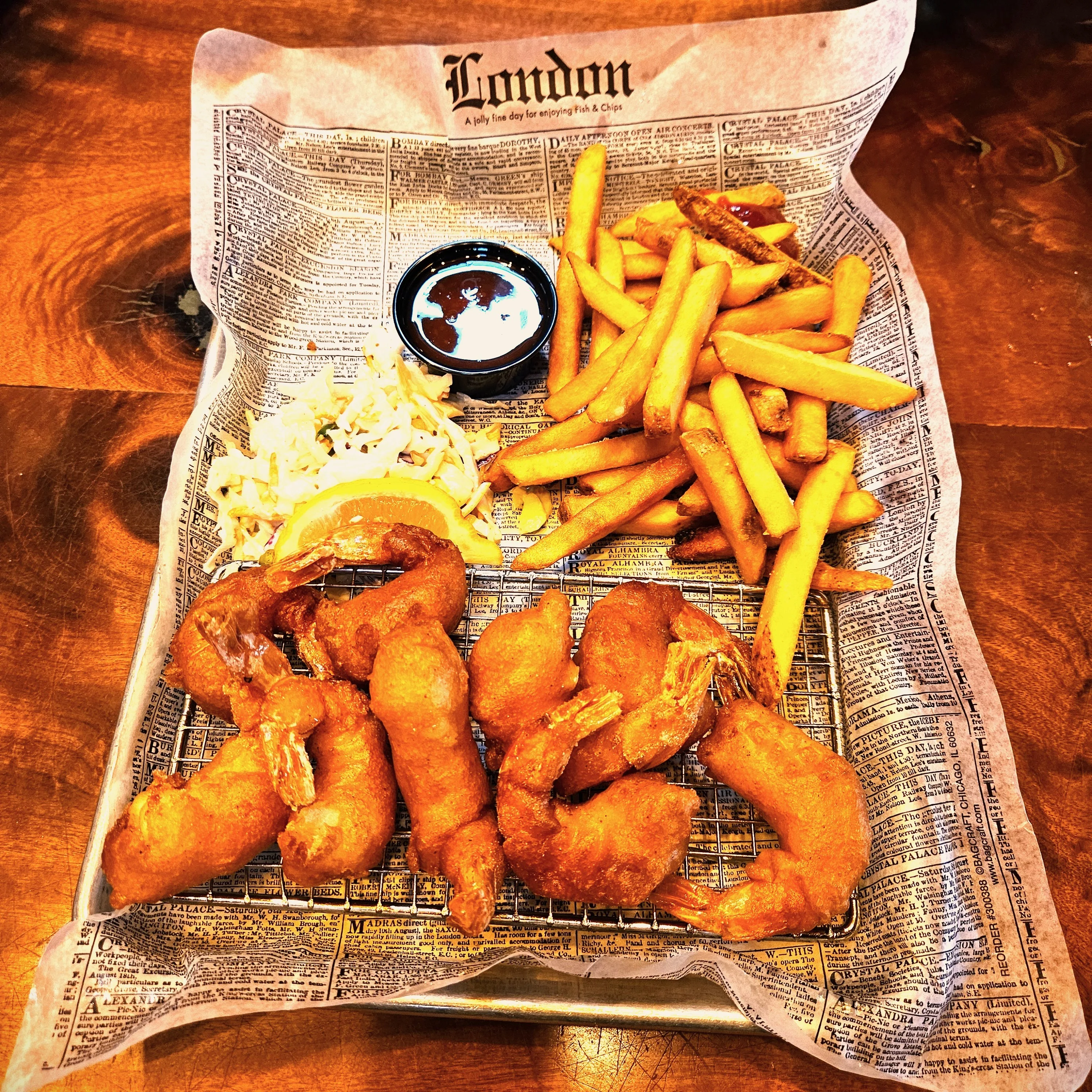 Crispy shrimp and fries served in a classic British style