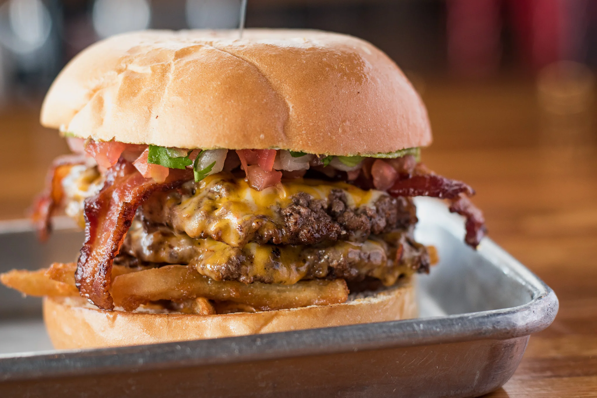 Juicy double cheeseburger with bacon and toppings