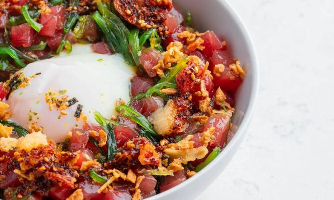 Hawaiian poke bowl with fresh tuna and poached egg