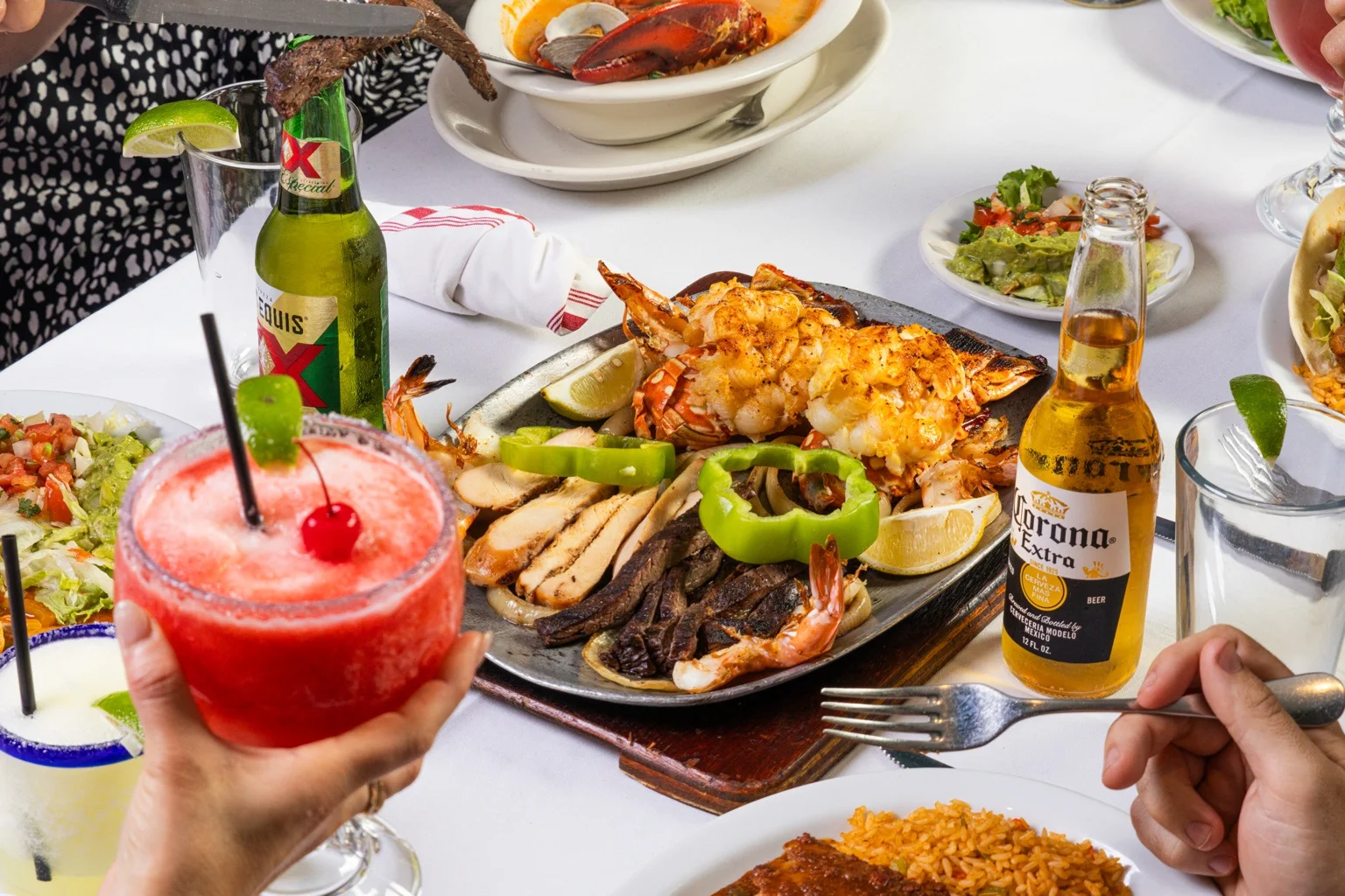 Sizzling Mexican seafood platter with shrimp and steak