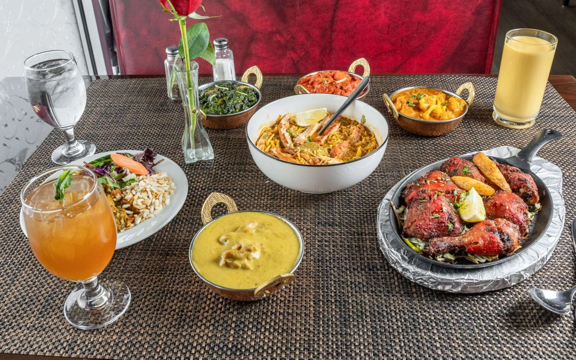 Assorted Indian dishes including biryani and tandoori chicken