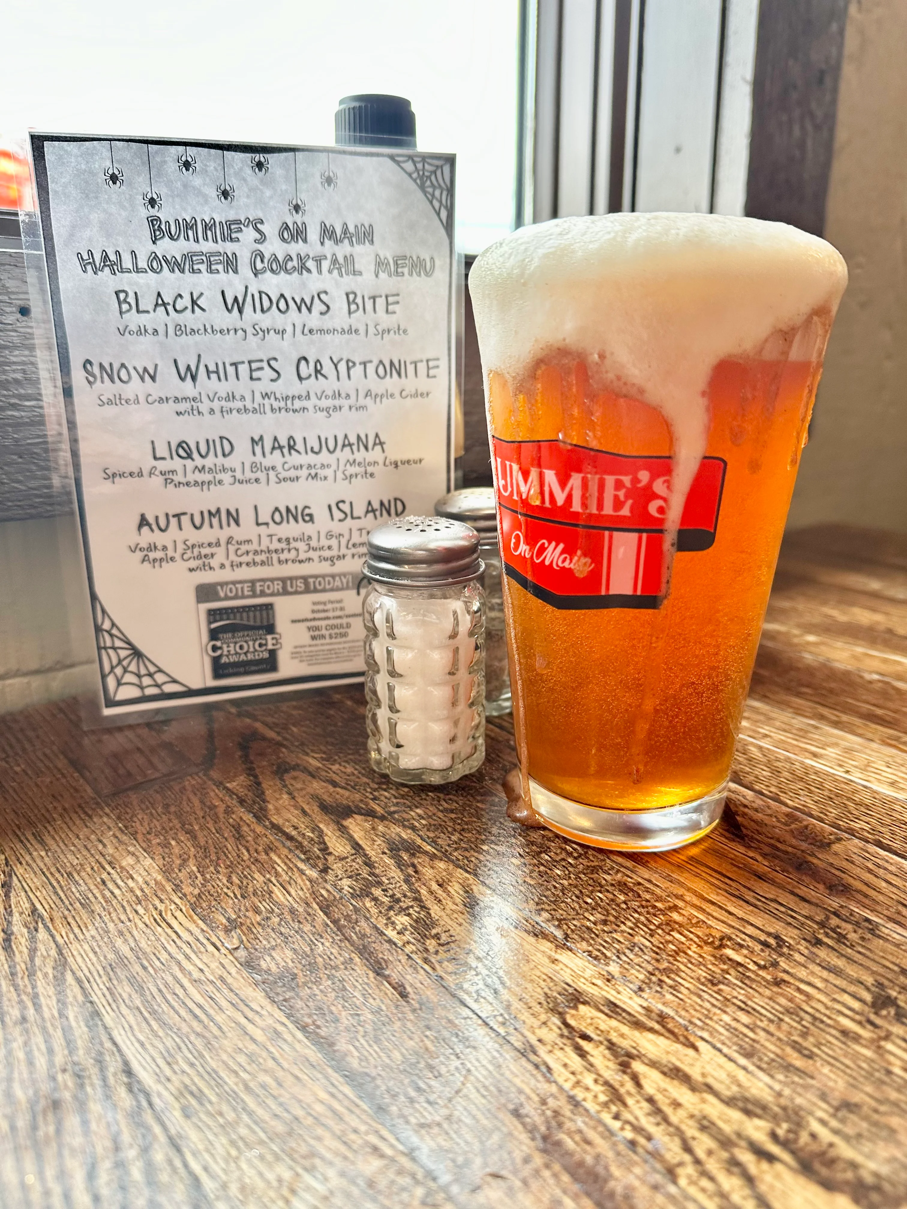 Halloween cocktail menu at a cozy bar with craft beer