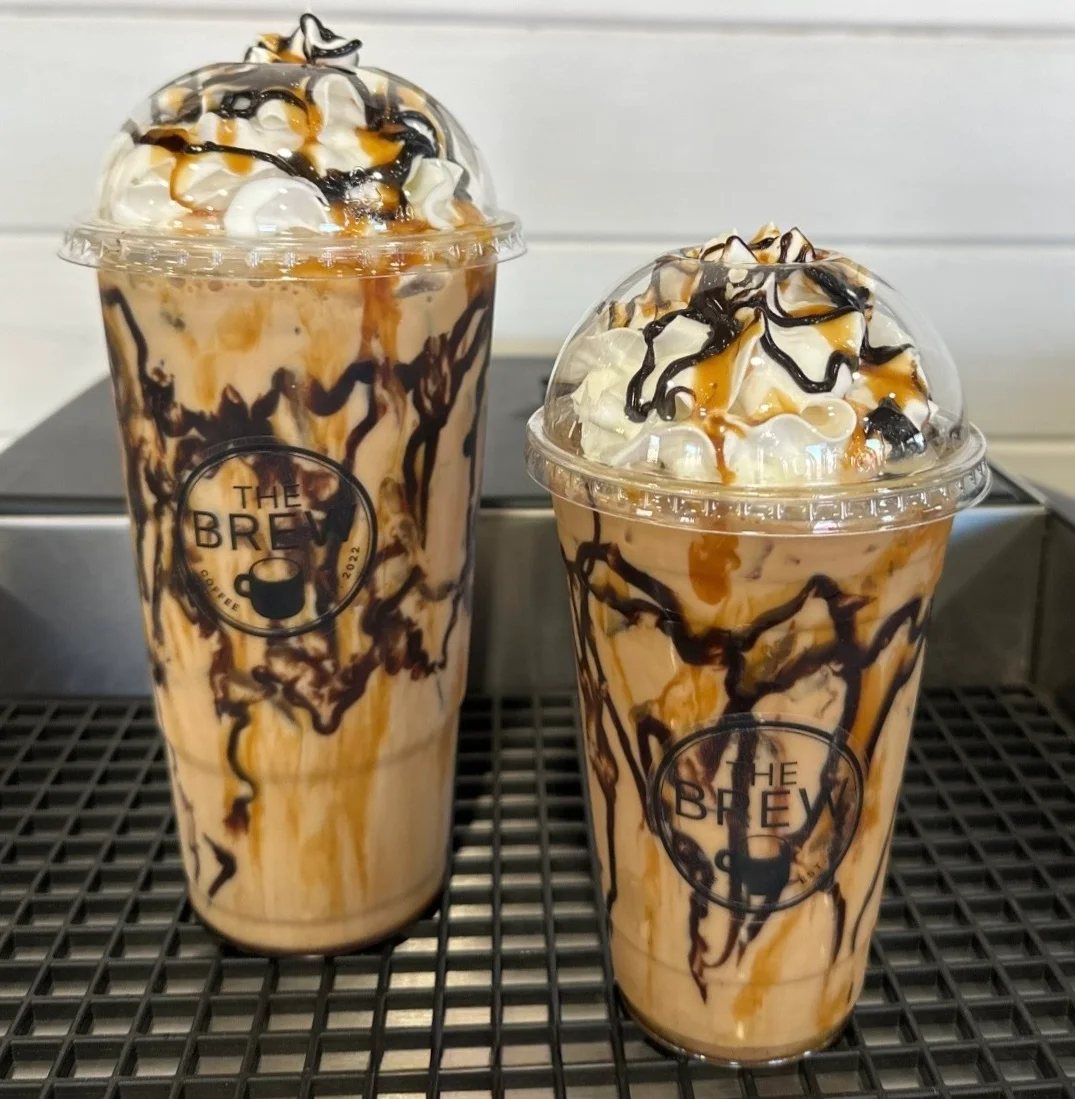 Iced caramel macchiato topped with whipped cream
