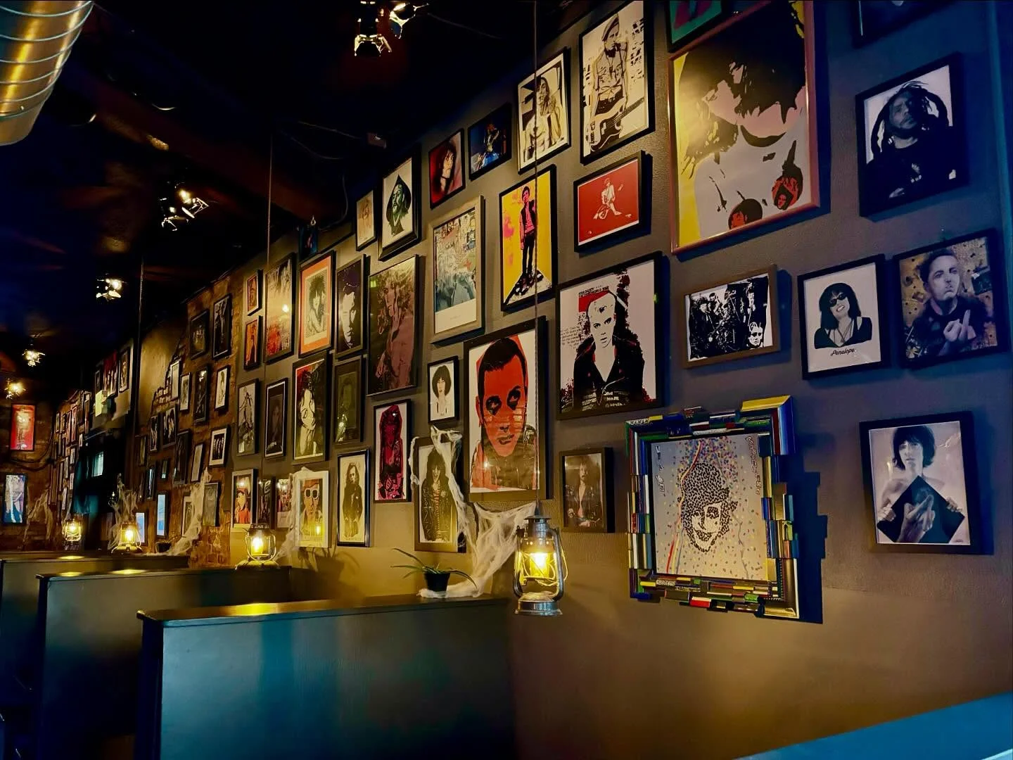 Eclectic restaurant interior with art-covered walls