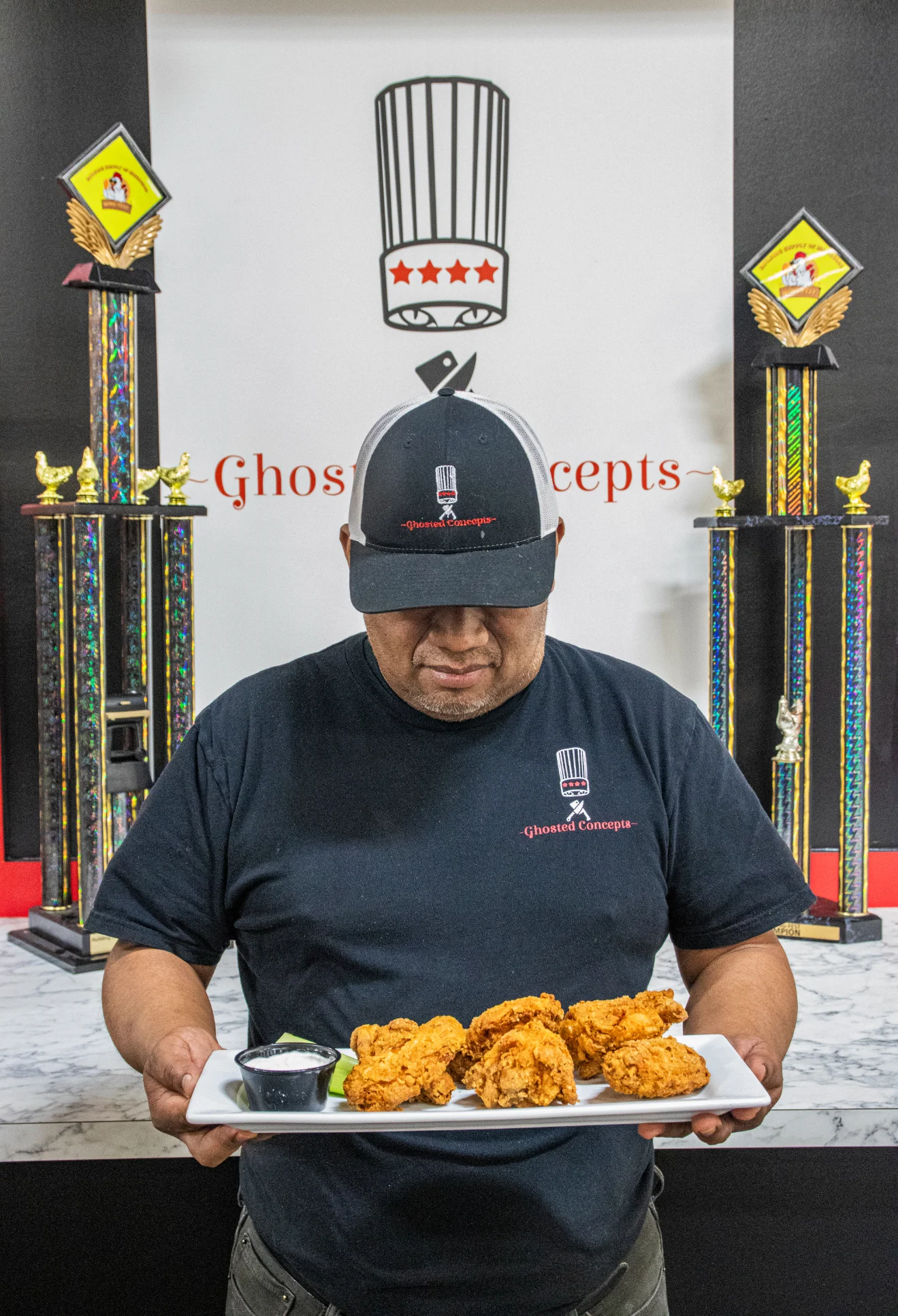Award-winning wings displayed on a wooden table with sauces.
