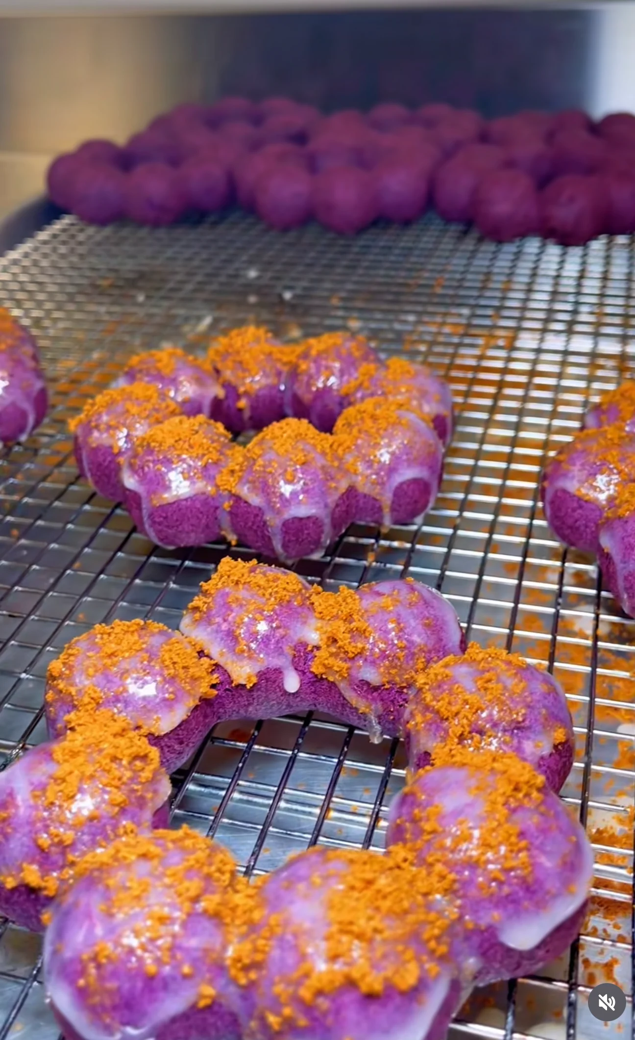 Purple ube donuts topped with orange crumble