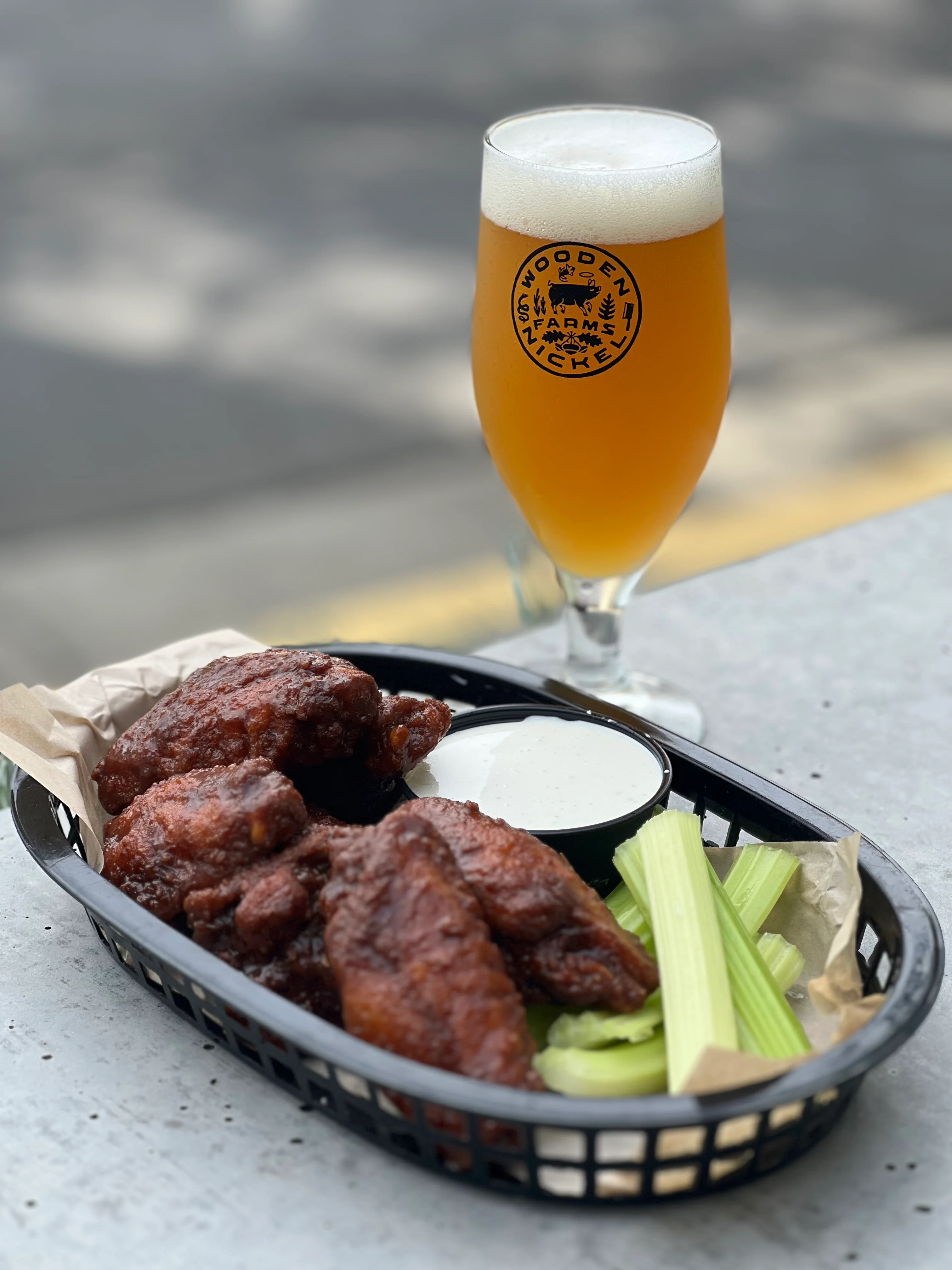 Crispy buffalo chicken wings with celery and ranch dressing