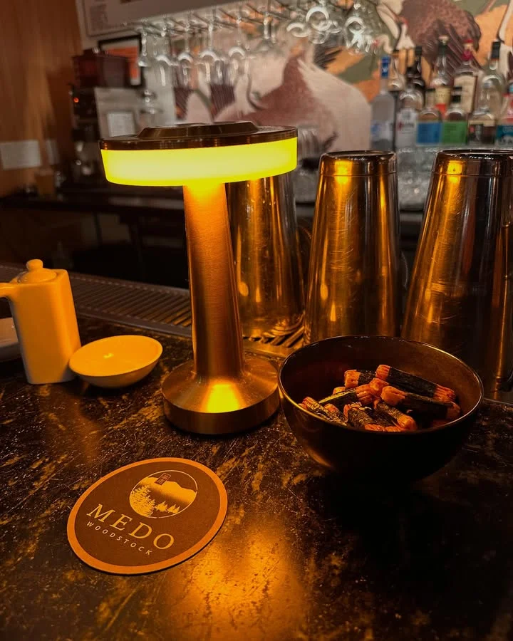 Cozy bar setting with warm lighting and decorative elements