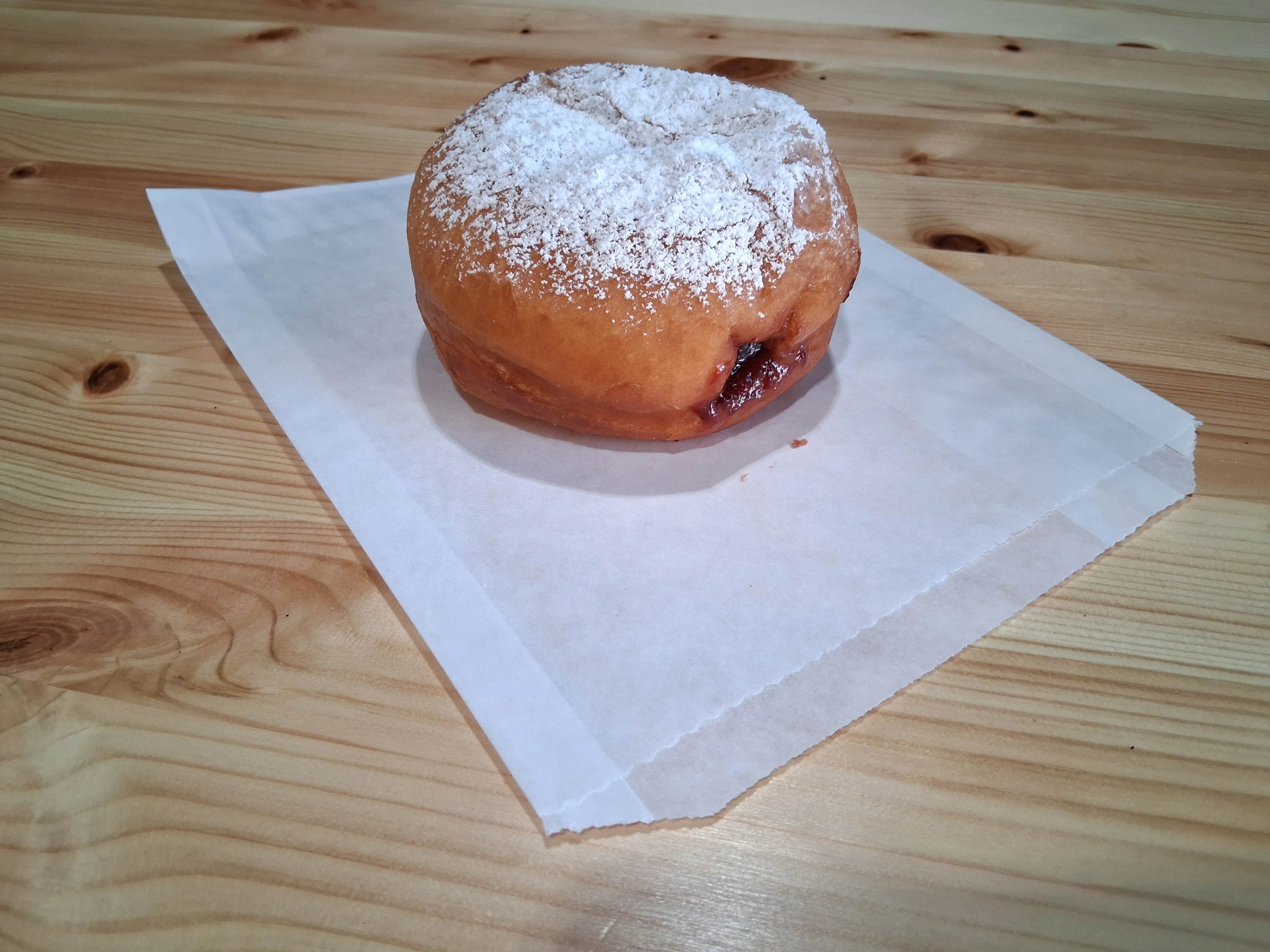Powdered sugar dusted jelly-filled doughnut