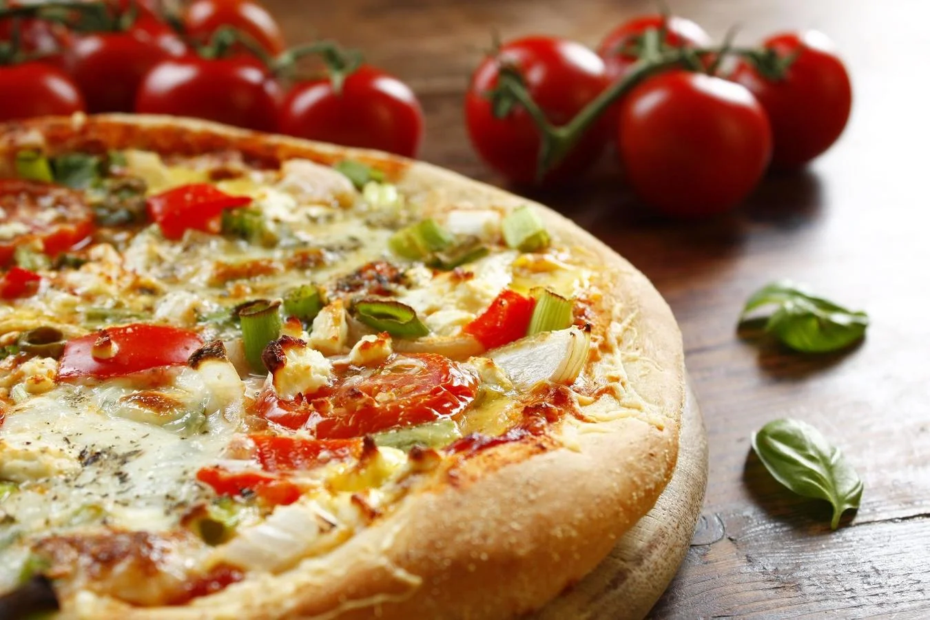 Vegetarian pizza with fresh tomatoes and herbs