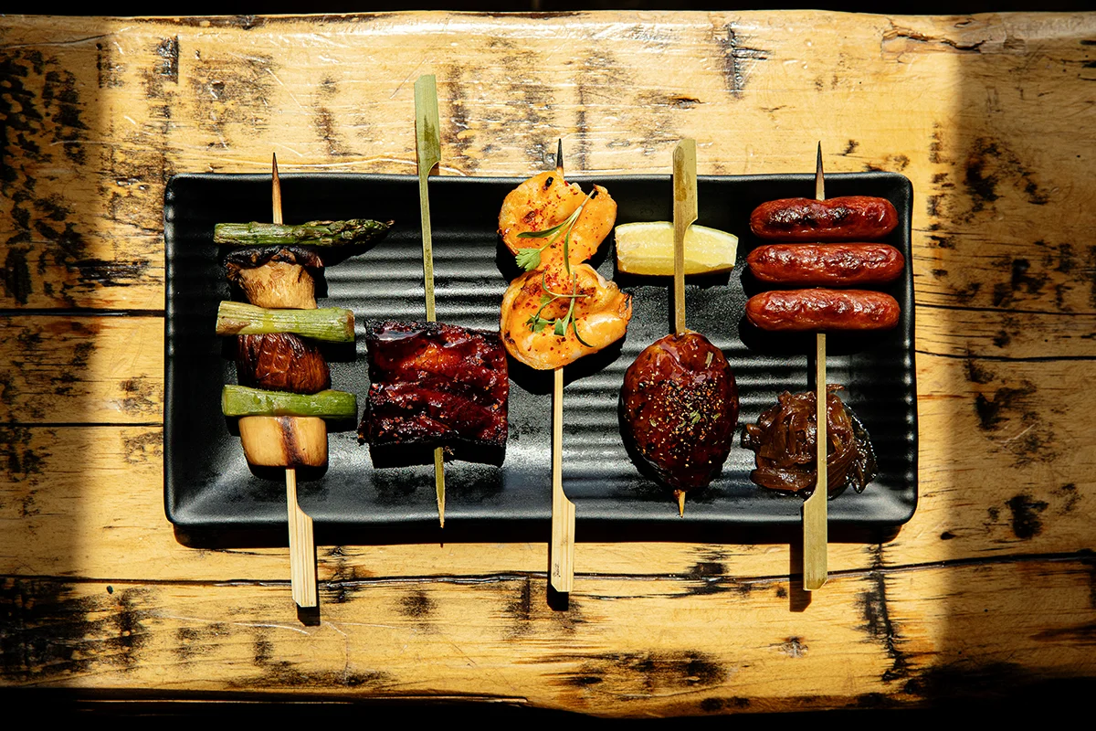 Assorted skewers of grilled meats and vegetables