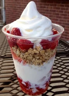Delicious parfait with yogurt, granola, and fresh raspberries