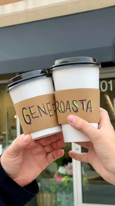 Two coffee cups in front of Generoasta café