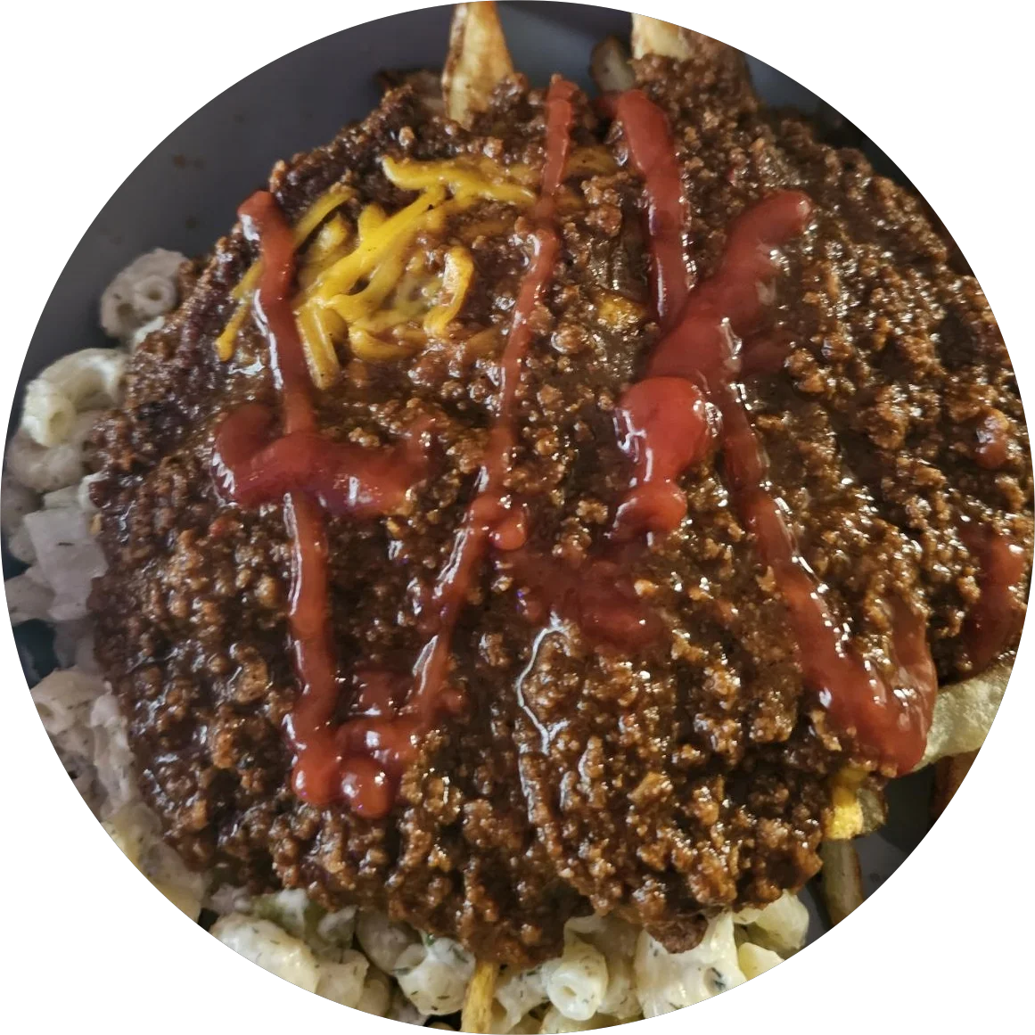 Chili cheese fries topped with ketchup
