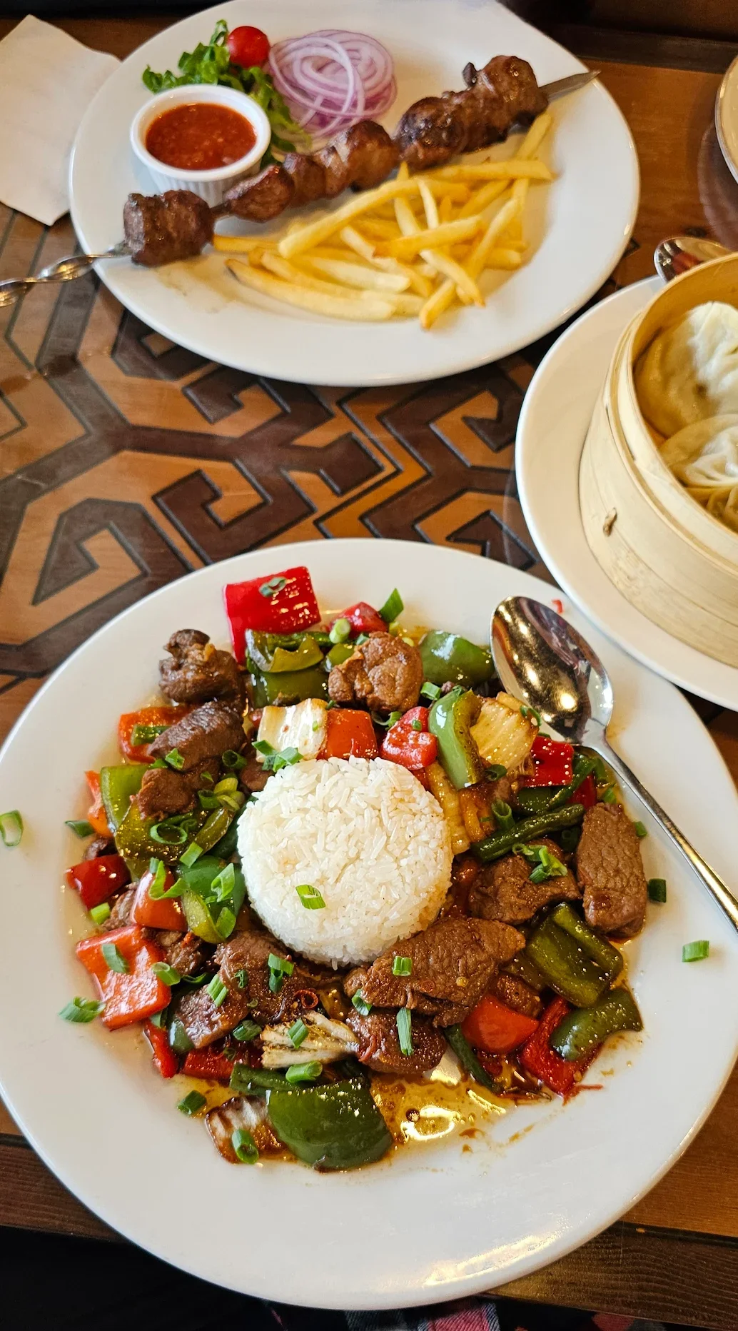 Sizzling beef stir-fry with rice and colorful vegetables