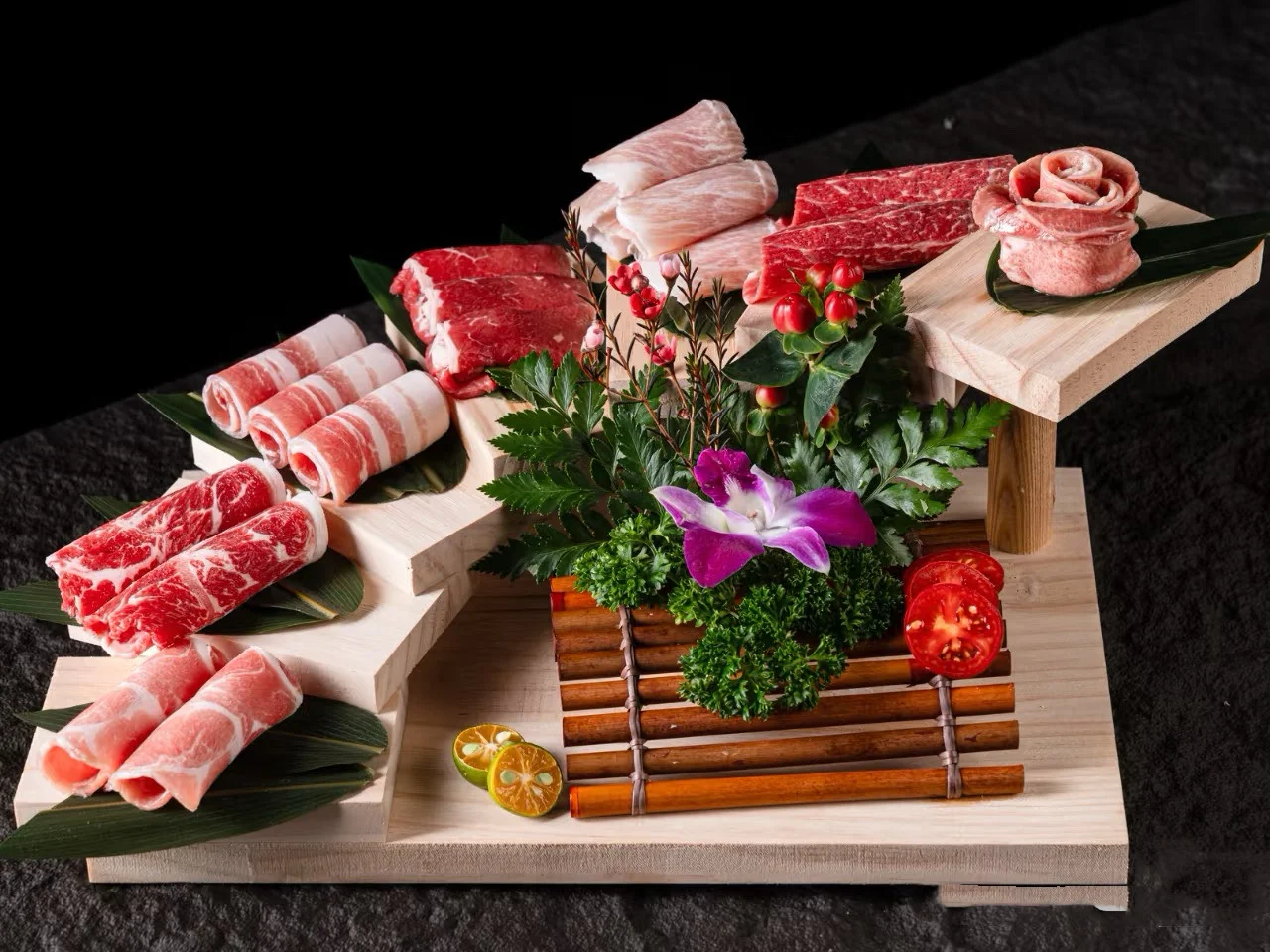 Japanese shabu-shabu platter with assorted meats and garnishes