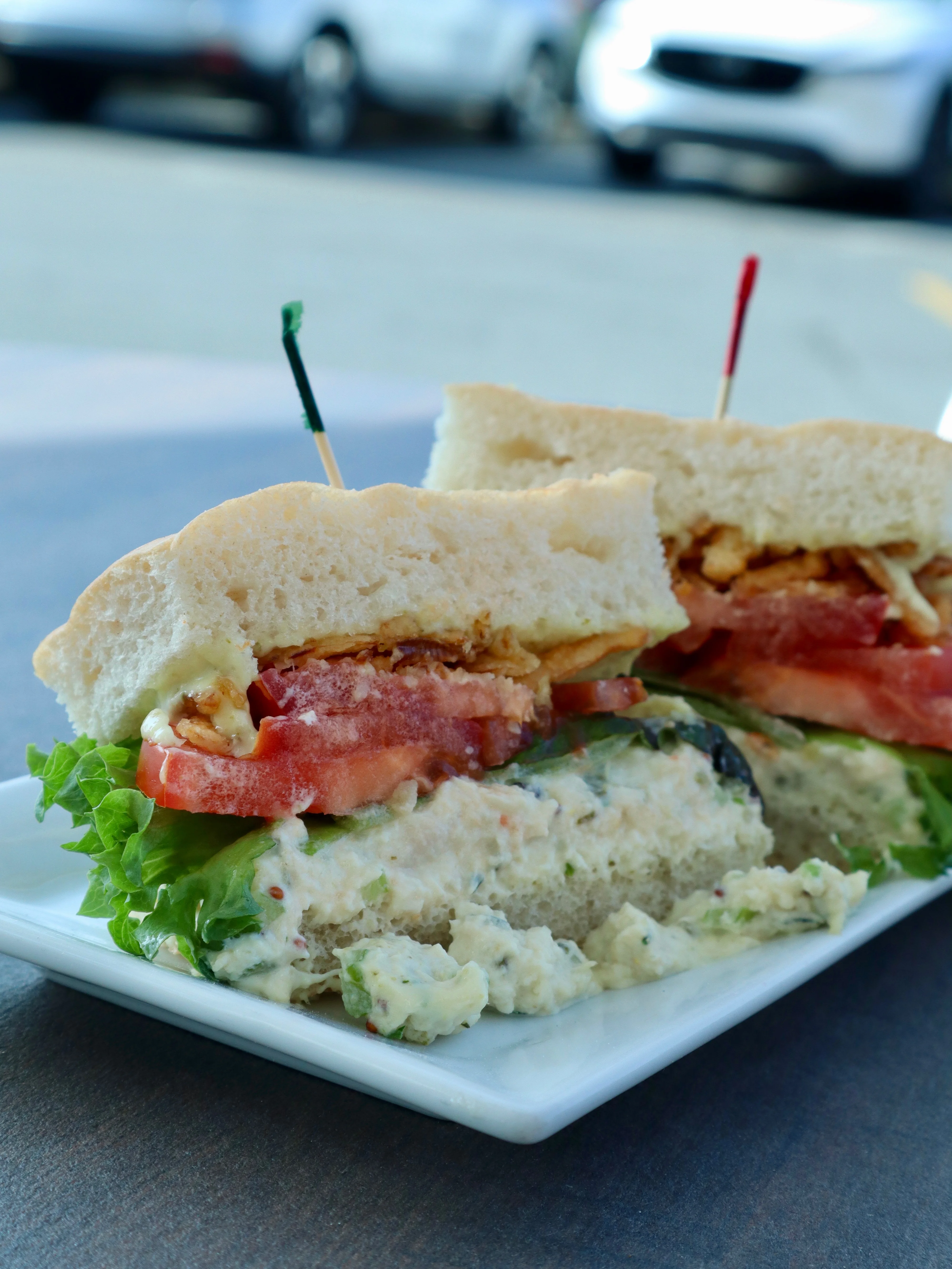 Delicious gourmet burger with fresh toppings on a wooden table